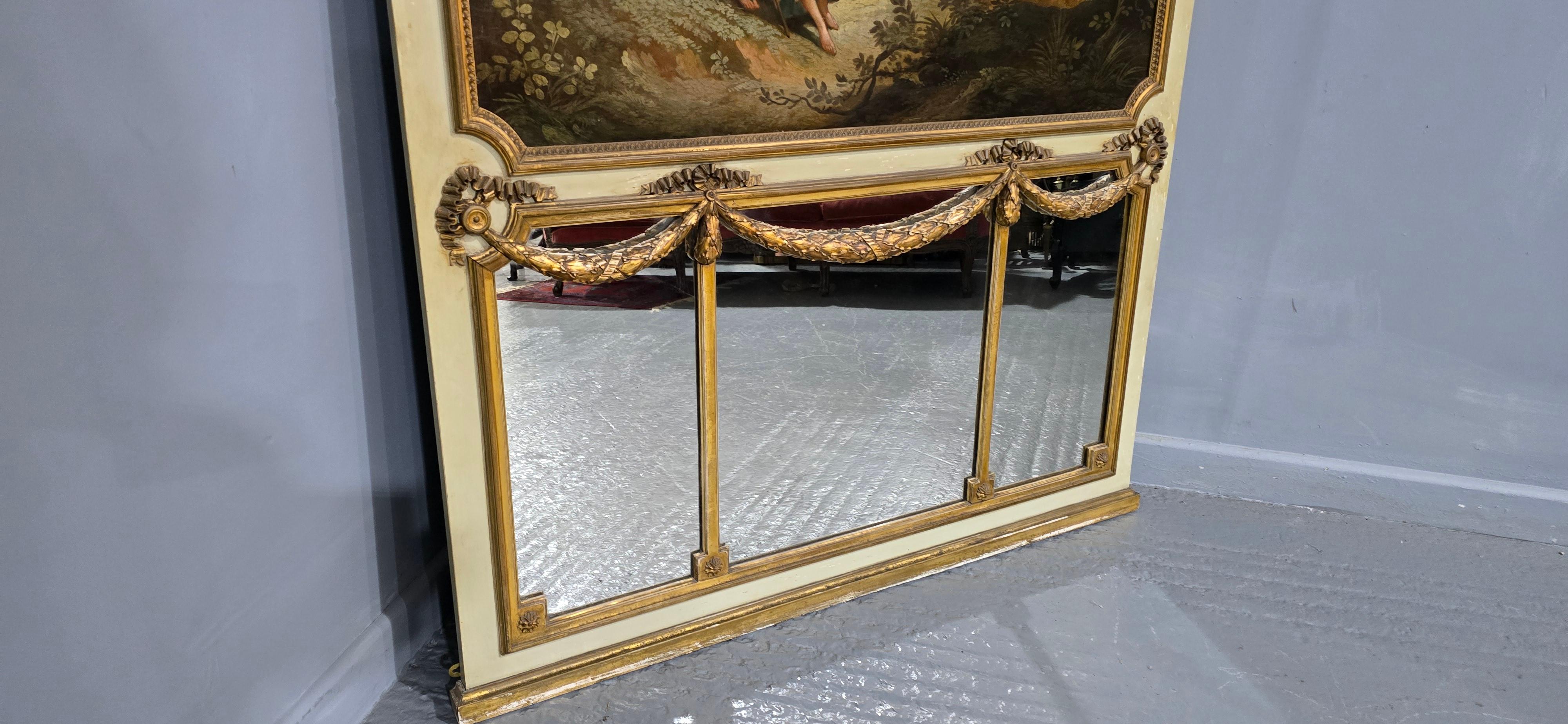 Splendida specchiera francese da parete, o da camino, con tripla lastra di specchio e pennacchi dorati sotto un olio su tela a tutta larghezza, in ottime condizioni generali.

Altezza 57
48,5