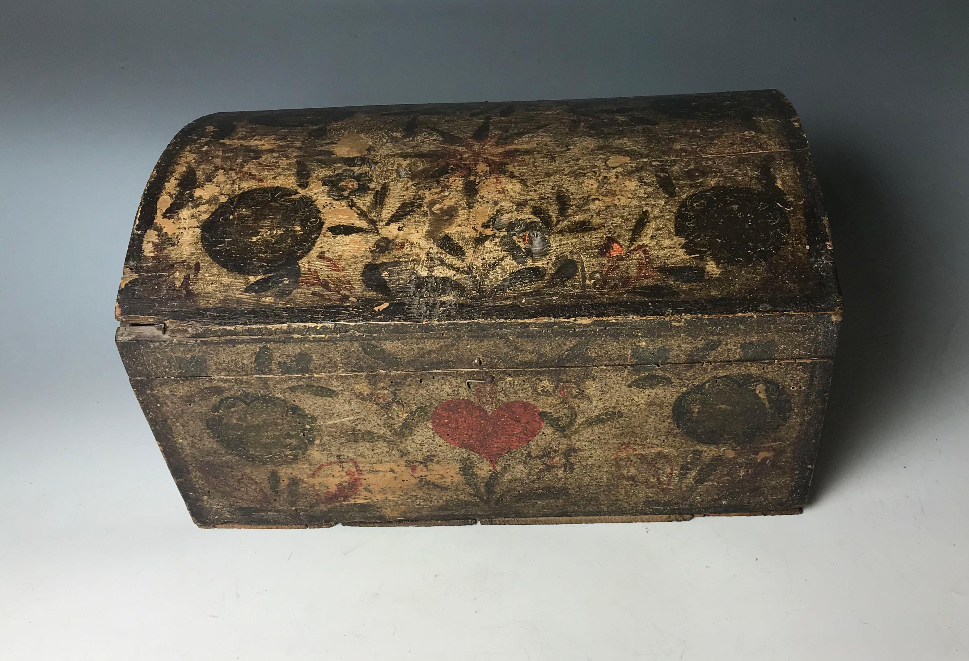 Antique French Painted Wood Normandy Folk Art Marriage Box
Pine wood with floral star and heart designs finely painted in cream with red black and green 
Circa 18th /  

44 x 25 x 25 cm 17 x 10 x 10 inches approx.
Condition: Age wear paint loss
