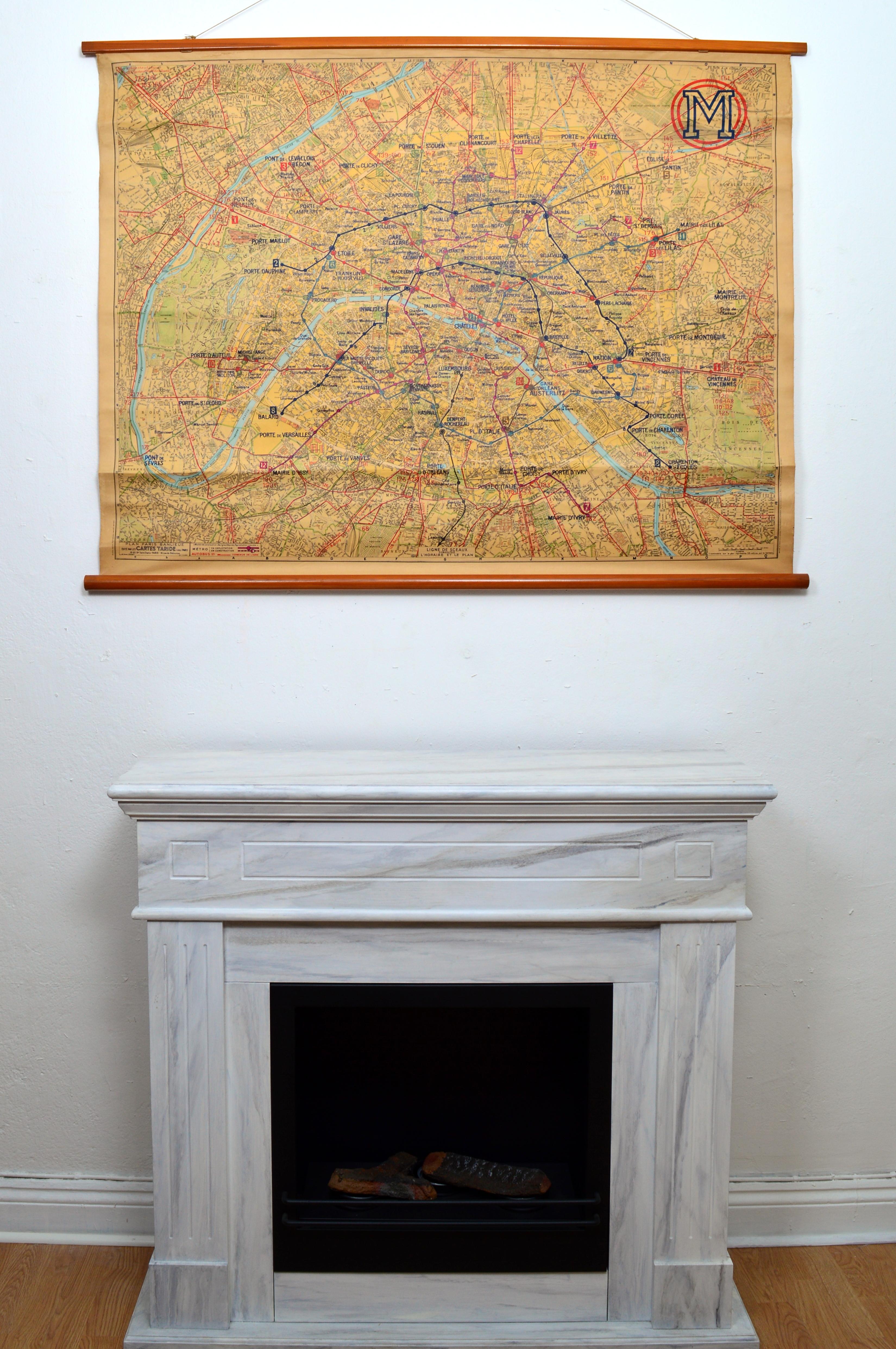 A large French map of the Parisian Metro from the mid-20th century. Showing a nicely worn appearance, a great piece for framing. The map depicts the metro and bus lines in Paris. Made by the Cartes Taride, Paris, this midcentury Metro Map will bring