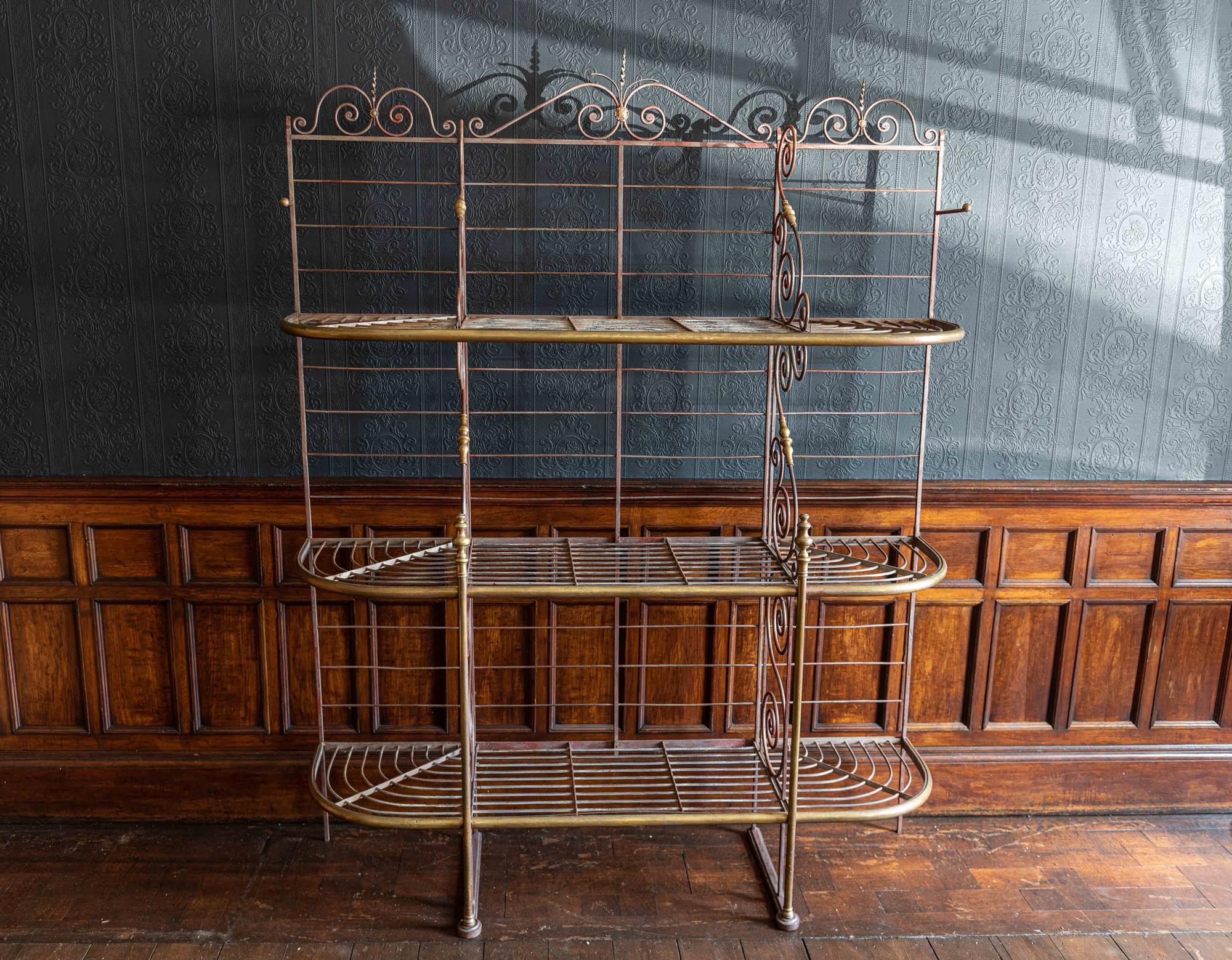Large French Parisian wrought iron & brass Boulangerie Baker's rack, circa 1900.

Sourced in Paris, silver/grey with the original red color showing through in places.
Decorative brass columns, finials and shelf edging trim.