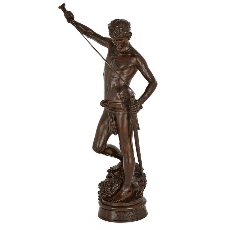 Large French patinated bronze sculpture of David by Mercié and Barbedienne
French, circa 1878
Measures: Height 77cm, width 36cm, depth 27cm

This superb patinated bronze sculpture is a famous example of late 19th century French decorative art.