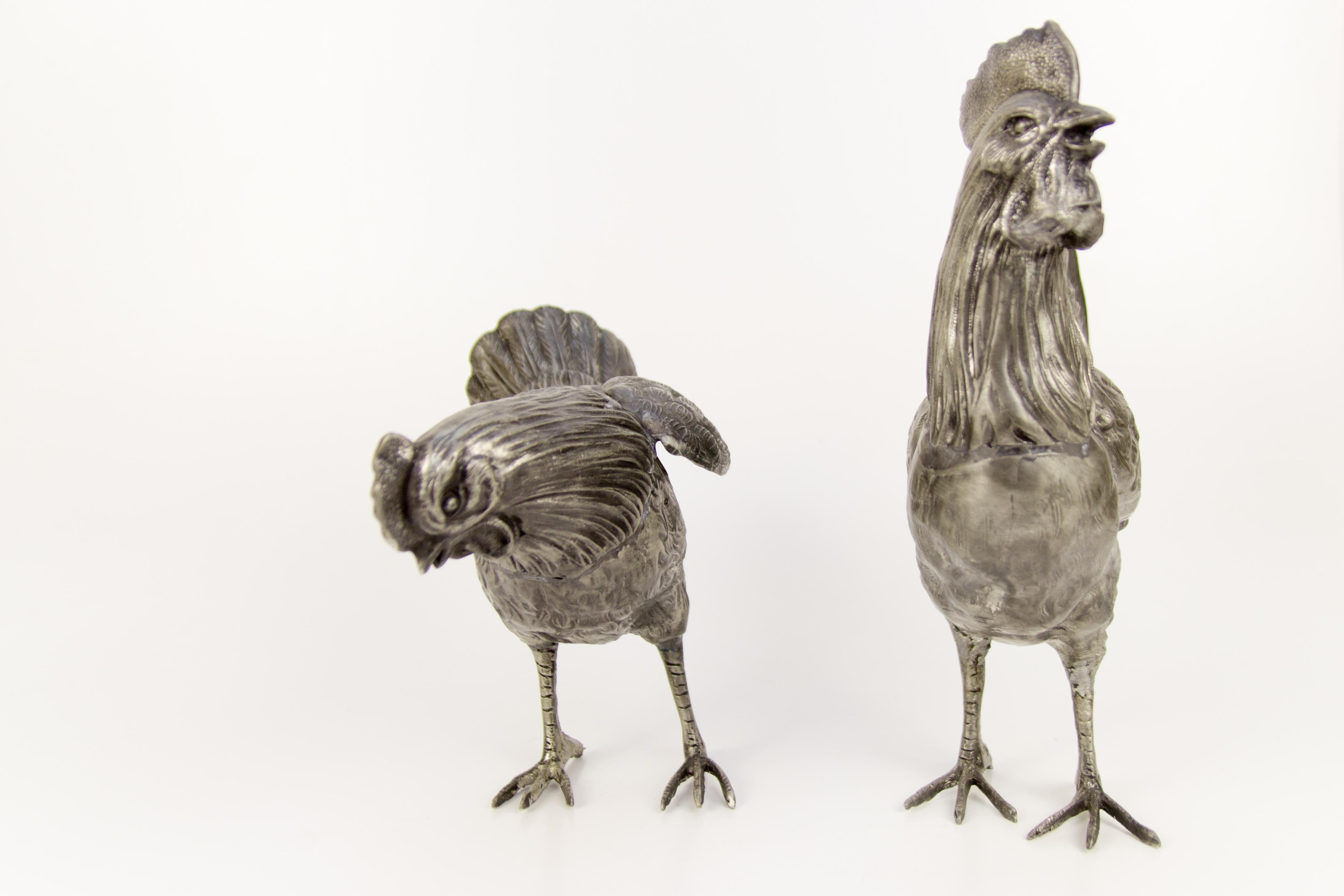 Adorable pair - vintage rooster and chicken sculptures / figures made of pewter in France in the middle of 20th century.
Dimensions: 
Rooster:
Height 31 cm / 12.2 in; width 25.5 cm / 10.03 in; depth 8 cm / 3.15 in.
Chicken:
Height 22.5 cm /