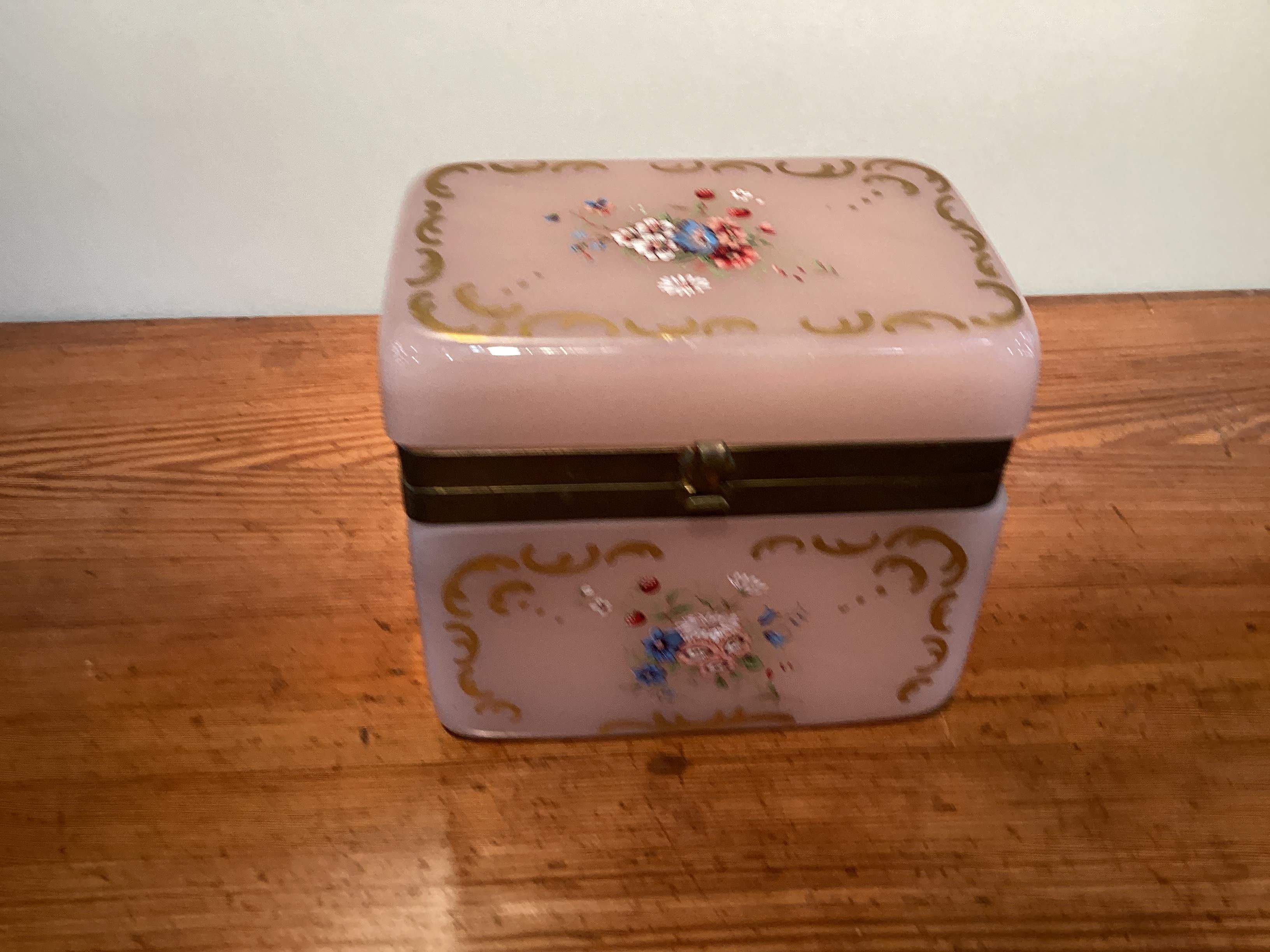 Large French Pink Opaline or Murano Box with Gilt and Floral Decoration. Finely executed hand painted decorations with gilt accents. An exceptional decorative item.