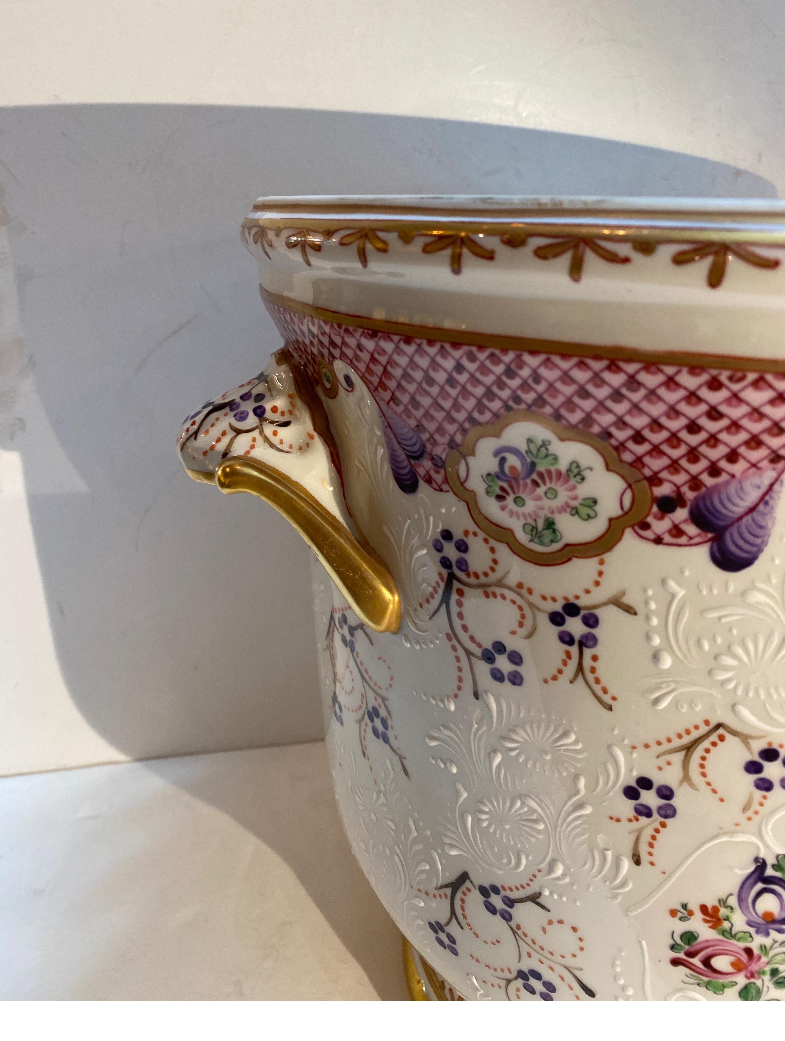 Beautiful hand painted French porcelain planter jardinière by Edme Samson, 19th century. The beautifully decorated large pot is in a Chinese Export style with an Armorial design on one side and a floral pattern on the other with hand gilt details.