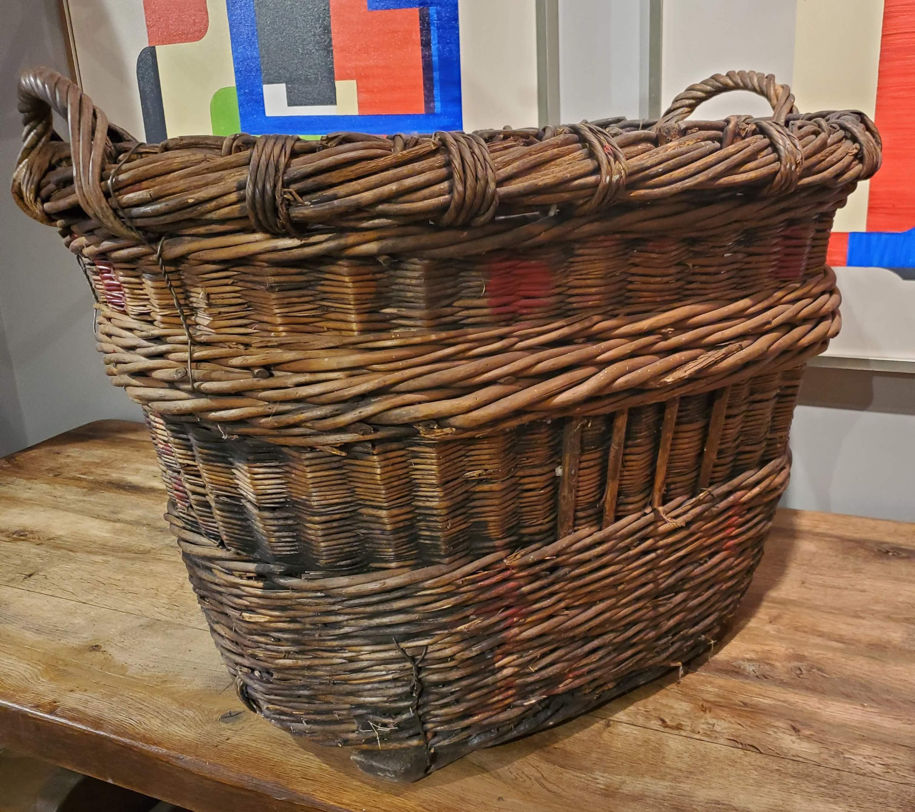 This lovely large French Provincial woven basket originally used for harvesting grapes is perfect to add additional storage to your room. Use it for pillows or extra blankets for guests. Great rustic appeal. (Pillows pictured not