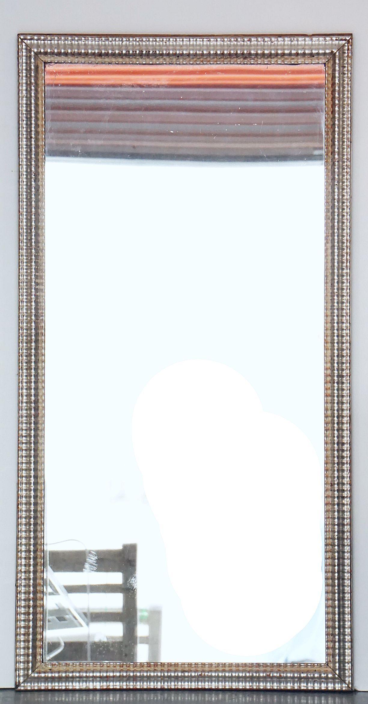 A handsome large French silver gilt rectangular wall mirror, with original glass, featuring a decorative raised, ripple edged moulding around the circumference of the frame and a lovely patina.

Ready to hang - Can be displayed vertically (portrait)
