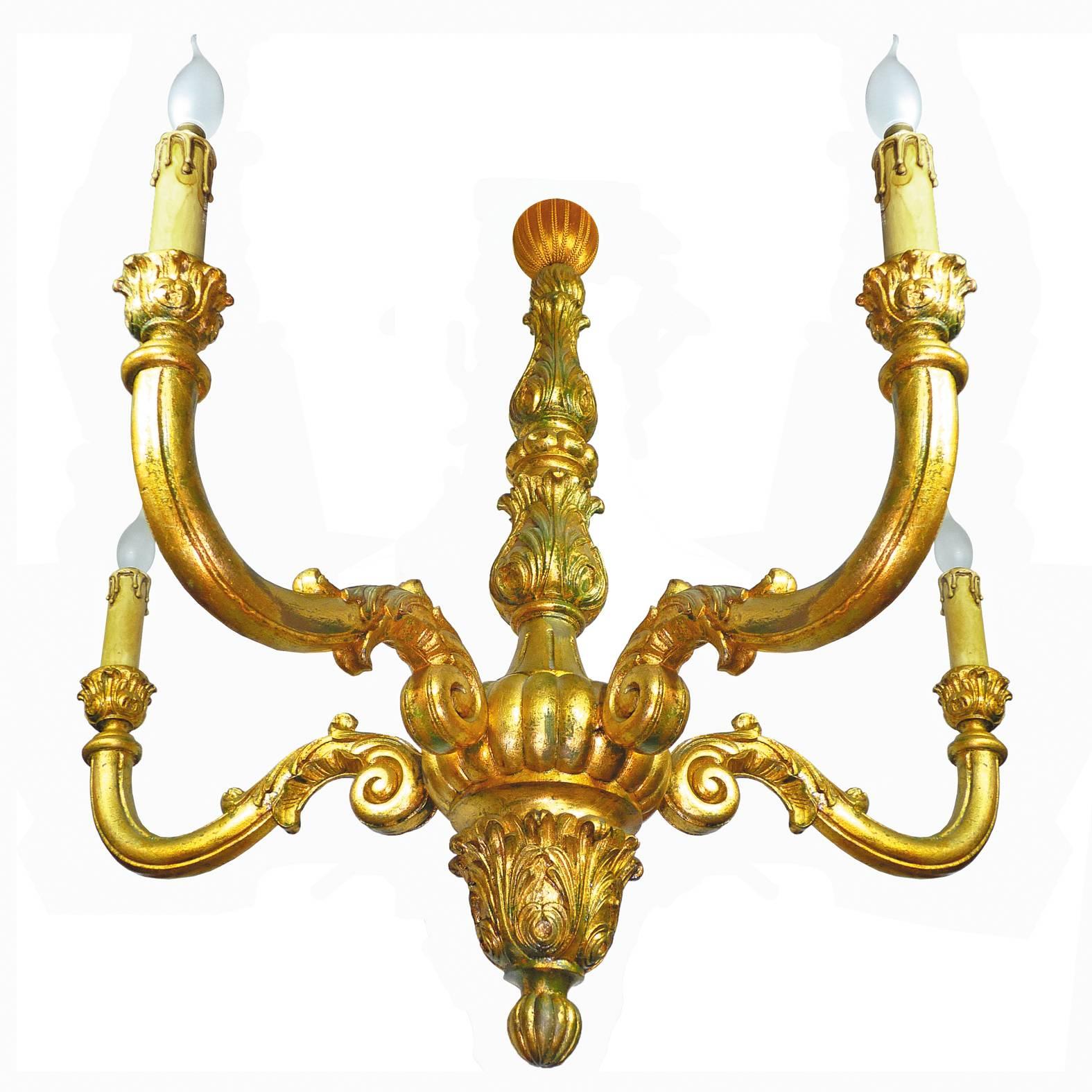 Large neoclassic wood carved gold leaf Baroque giltwood five-light chandelier.
Measures:
Diameter 36 in/ 90 cm
Height 36 in / 90 cm 
Five light bulbs E14/ good working condition
Assembly required. Bulbs not included.


 