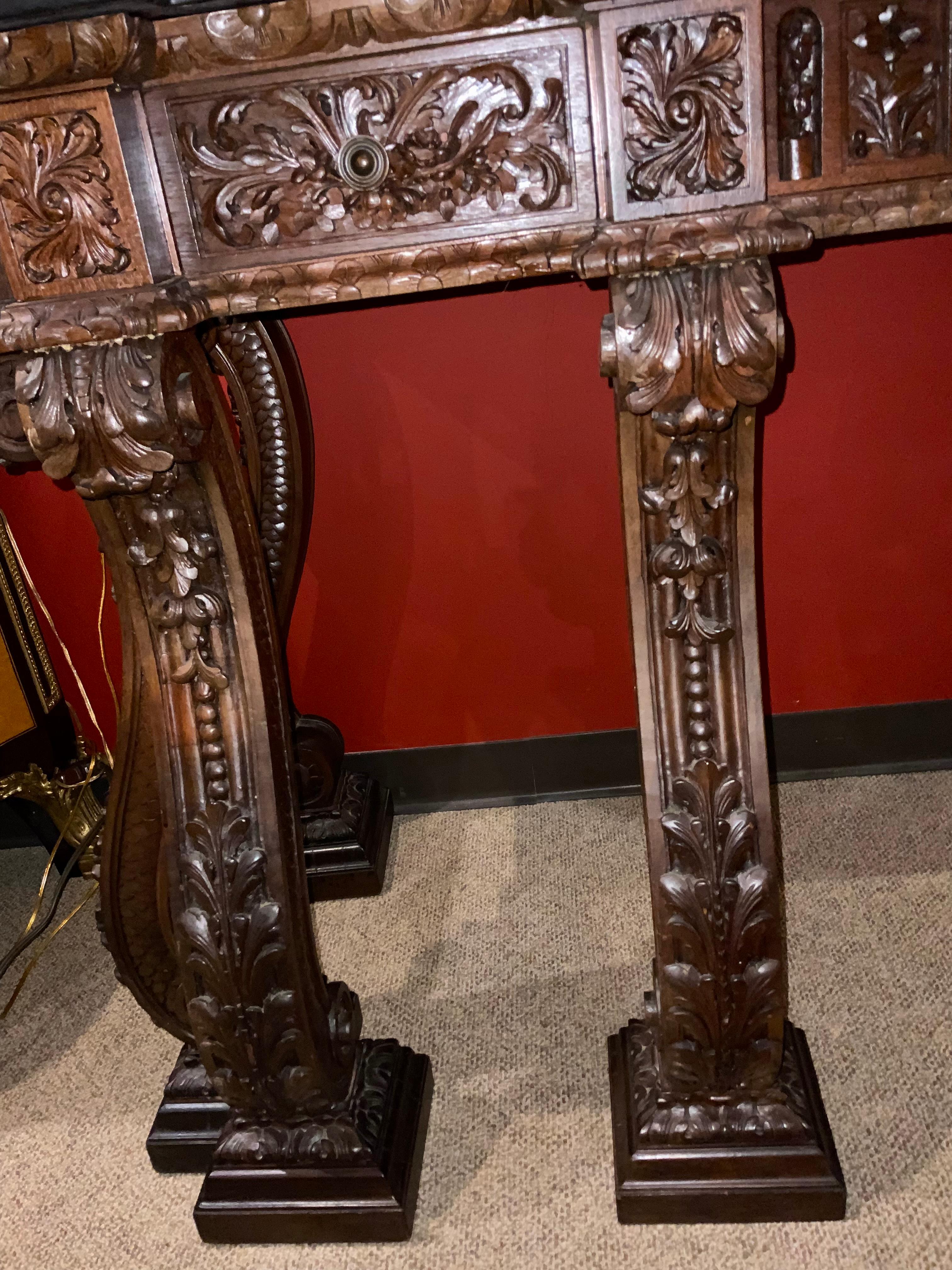 20th Century Large French Renaissance Style Carved Walnut Console with Black Marble Top For Sale