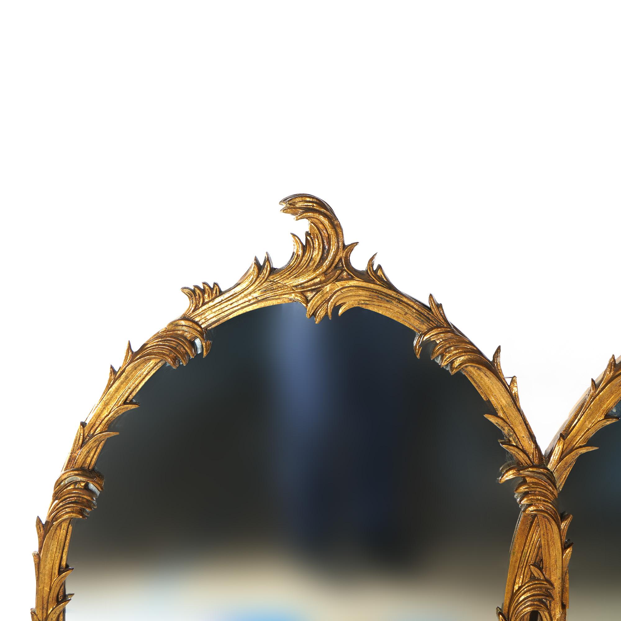 A French Rococo style large wall mirror offers giltwood double-oval frame in foliate form, 20th century

Measures - 42.5
