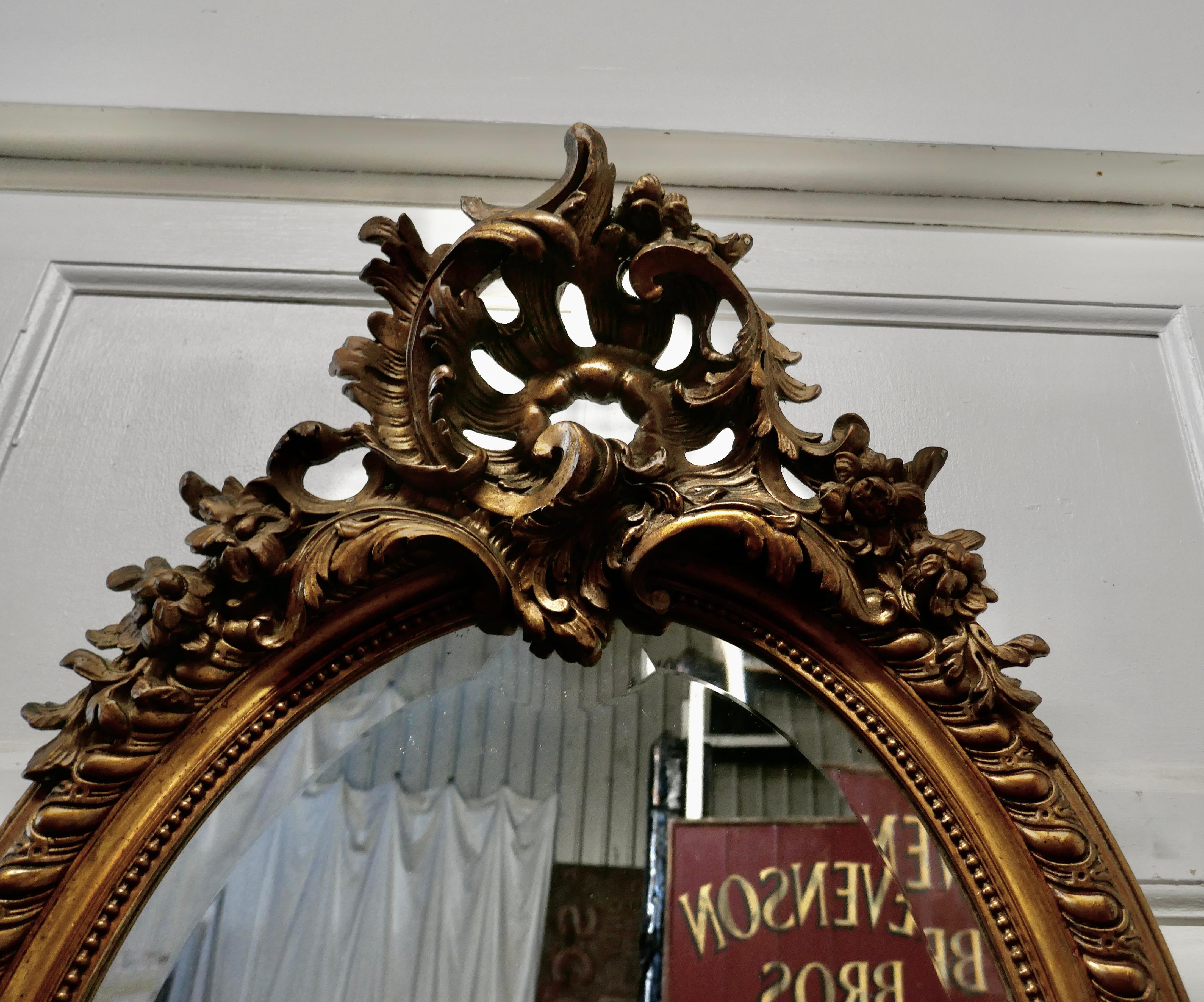 19th Century Large French Rococo Oval Gilt Wall Mirror For Sale
