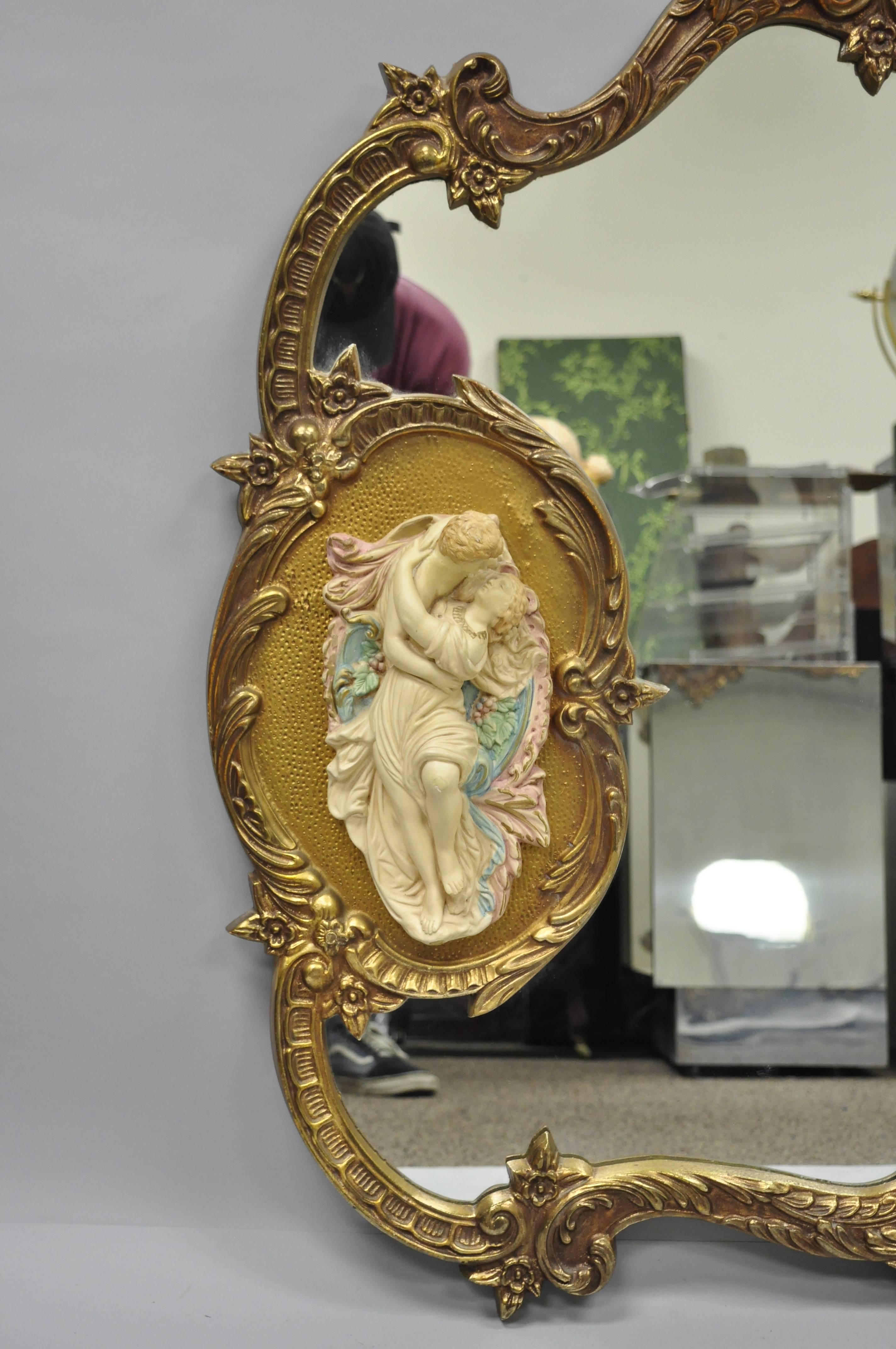 Large French Rococo style gold wall mirror with bisque figural 