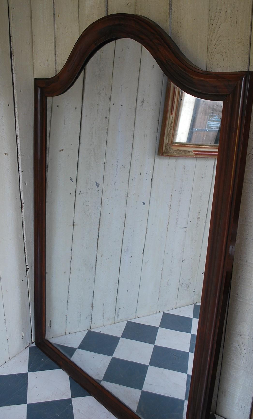 A beautiful large French overmantle mirror. Veneered in Rosewood with original foxed looking glass beautifully patinated with stardust. Excellent size for above a console or chimneypiece would also be good as a dressing