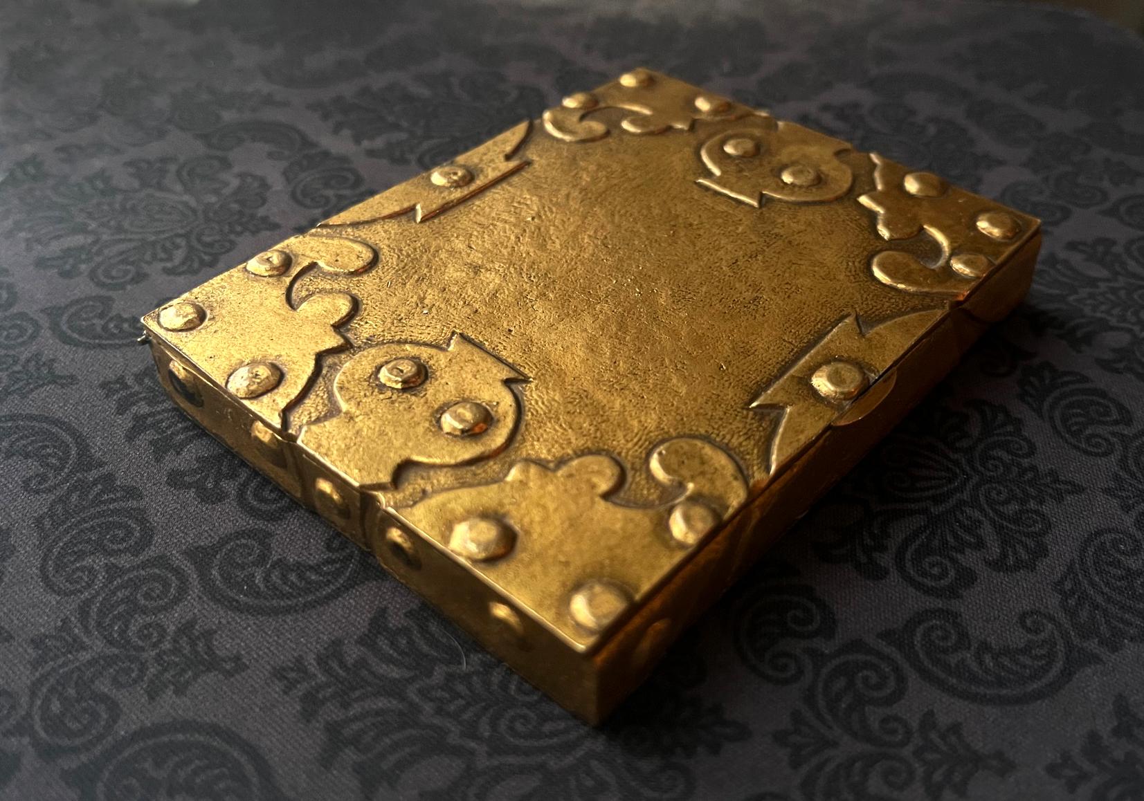 A large bonze box (based on the size, it is likely a card case) by French Parisian art jewelry designer Line Vautrin (1913-1997) circa 1950s. The box features an interesting design in which stylized hinges were folded over on the edges and corners