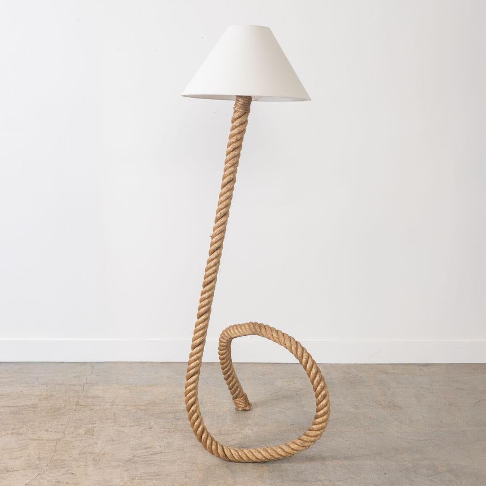 Incredible large sculptural rope floor lamp in the style of French designers Adrien Audoux and Freda Minet from France, 1960s. Beautiful curvy base and stem in wrapped rope. New tapered linen shade and newly re-wired. Original rope shows nice patina