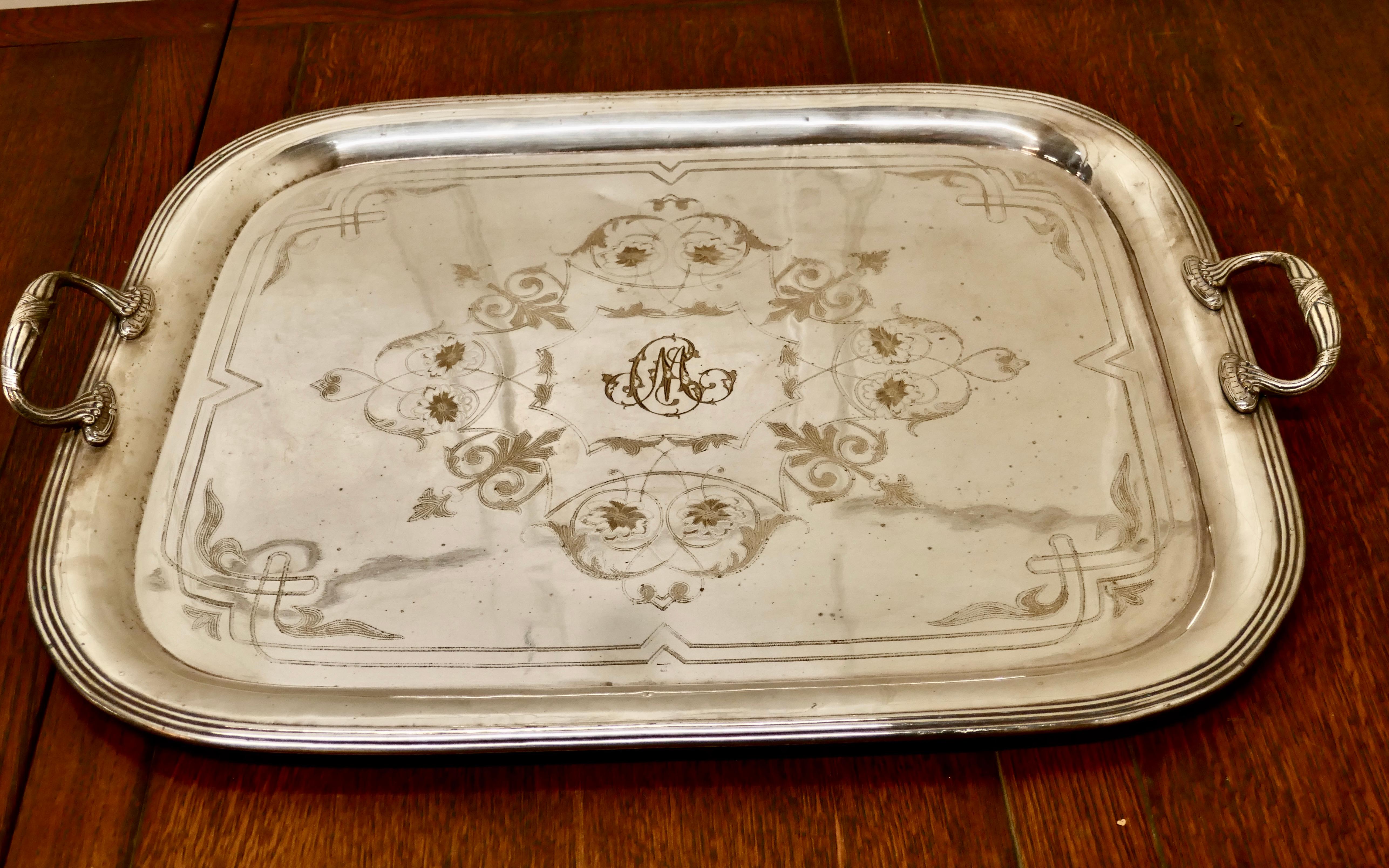 Large French silver plated tray by Lame & Lacroix 


A large and heavy decorated Art Deco tray with a monogram MC to the centre. The tray has a tramline edge with carrying handles at each end
The Tray is in good condition with some marking to