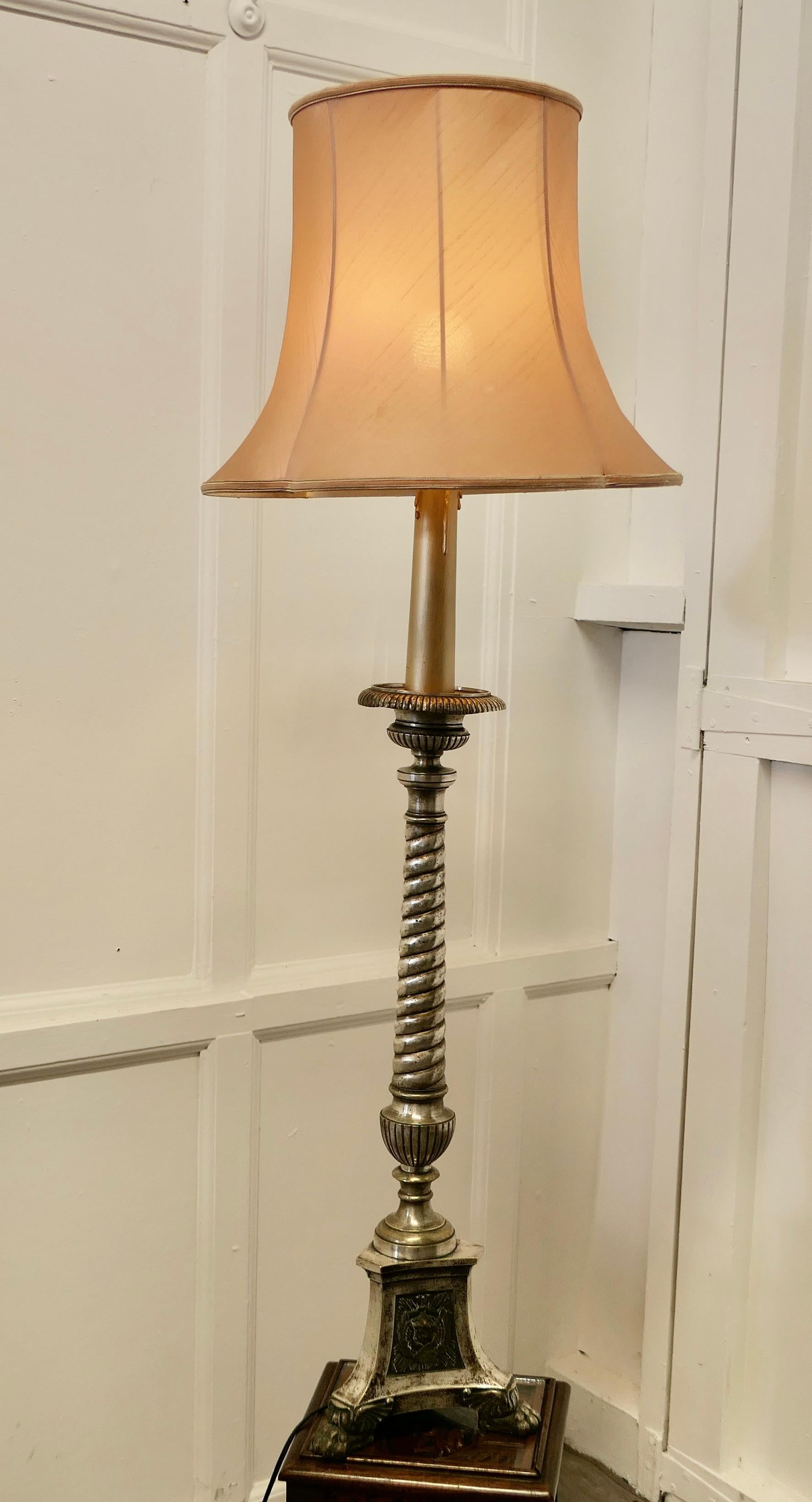 Large French Silvered Alter Lamp

This is a very beautiful piece, it originates from a French Church it stands on a decorative 3 sided base, the central column has a delightful twist to the upright
The lamp is heavy, it is made in brass with