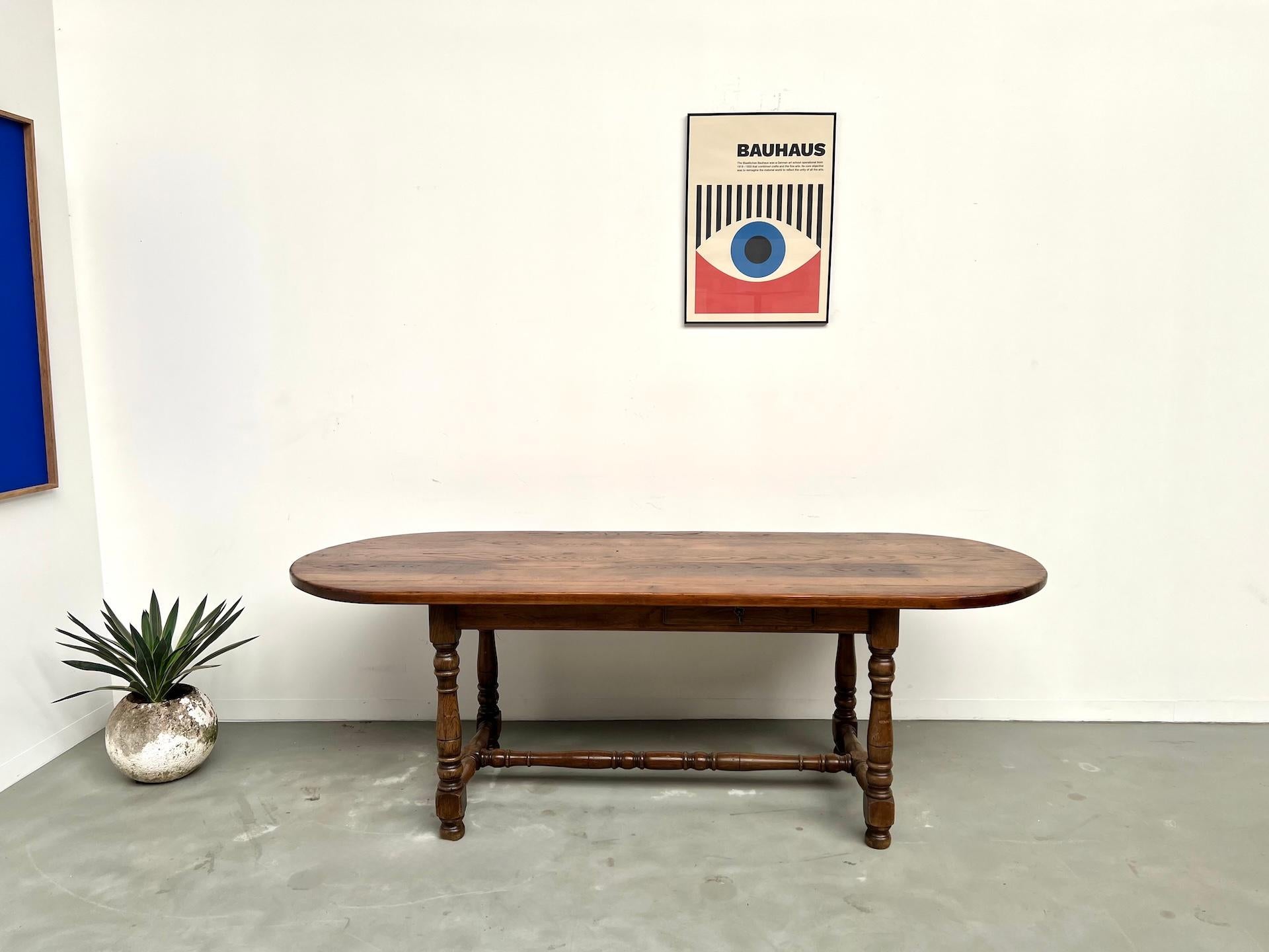 Large french solid oak table – Circa 1900

Maison Lecan presents this elegant early 20th-century dining table in solid oak. With its turned legs and stretcher base, it reflects the timeless beauty of French traditional craftsmanship.

The tabletop