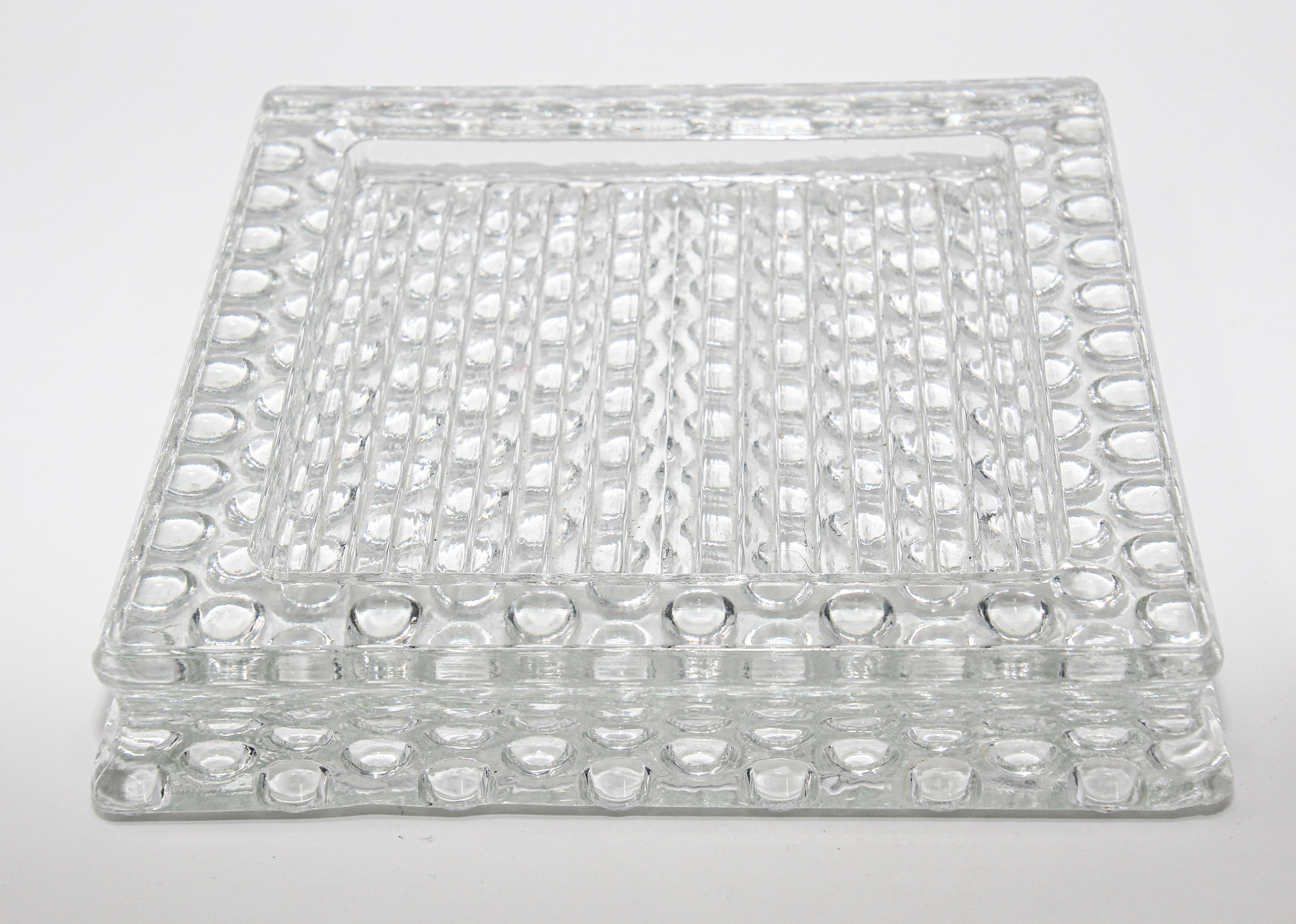 Beautiful large square French glass ashtray, 1930s design,
mid-20th century heavy cut glass ashtray in Bauhaus, Art Deco style.
Thick clear glass slab tray or desk tidy.
Square shape, a perfect accessory for the desk as a catchall or a cigar