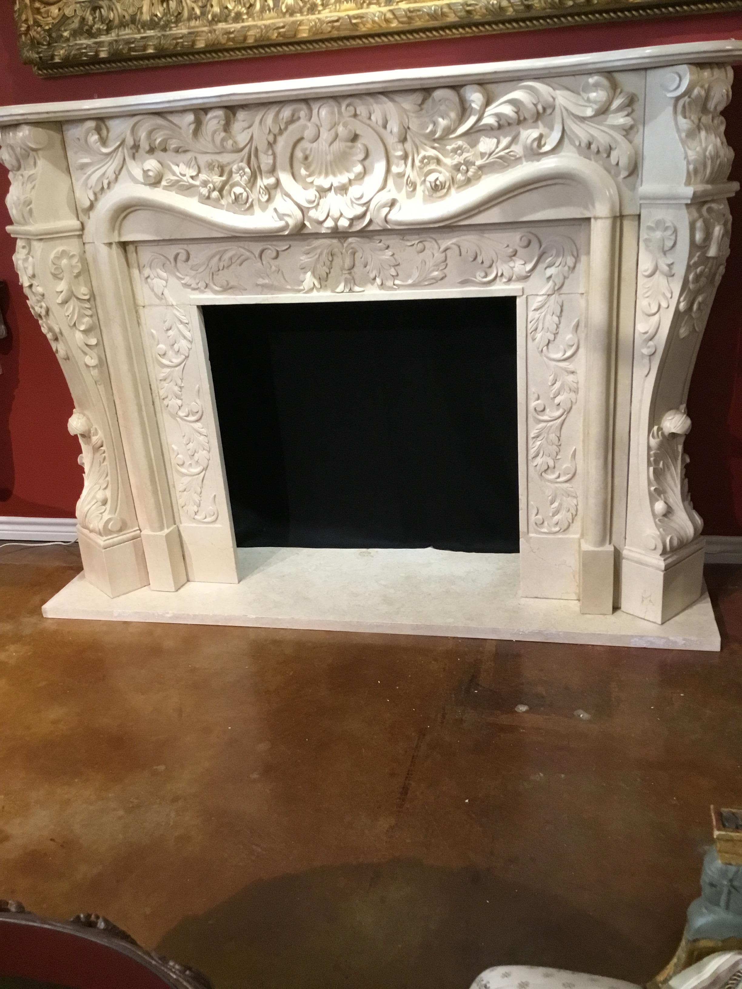 Large French Style Cream Marble Mantel, Hand Carved with Floral Designs In Good Condition In Houston, TX