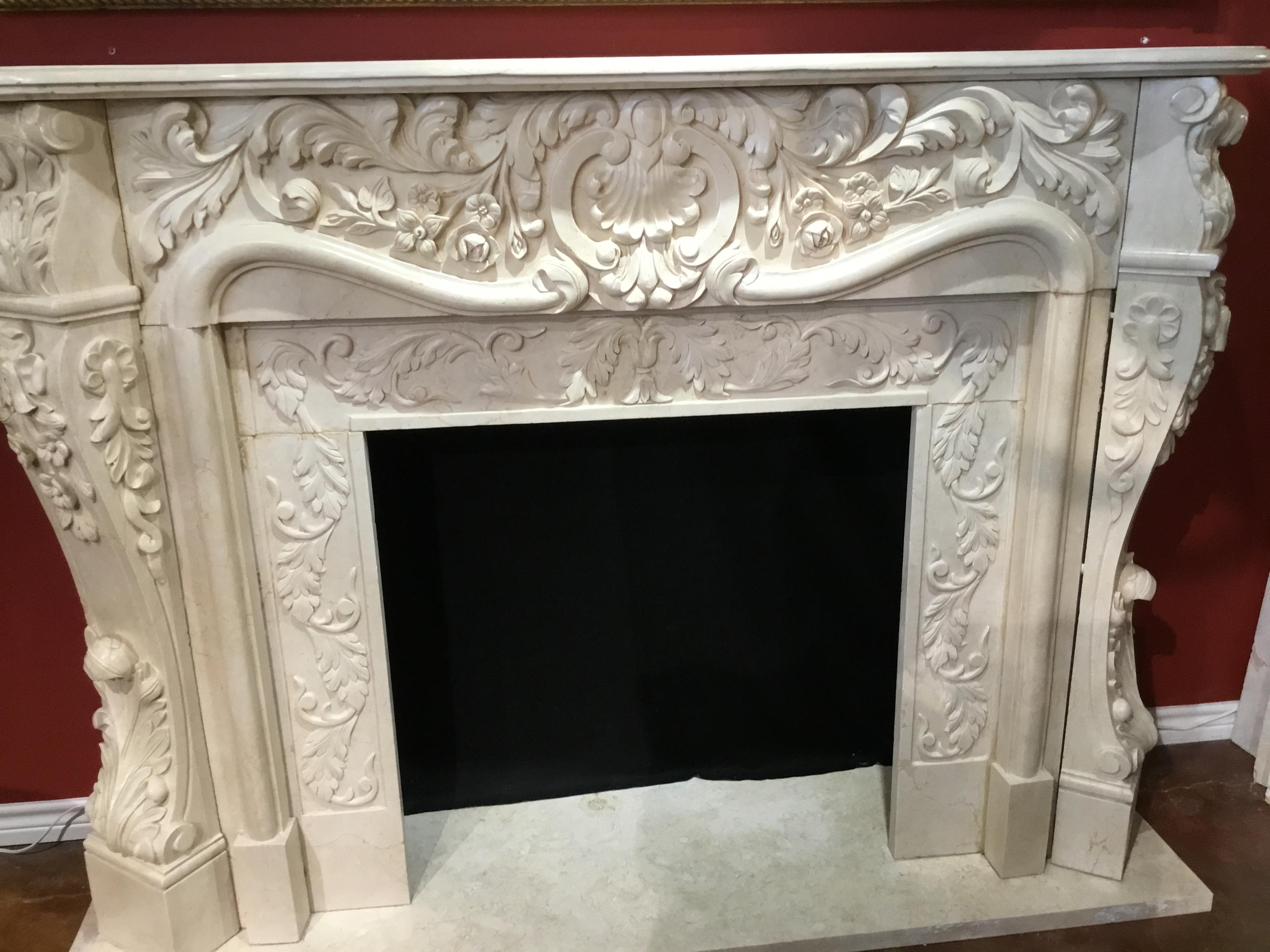 Cream marble hand carved in intricate designs featuring floral and foliate designs. 
Graceful curved legs at the front angle of this piece makes a desirable presentation 
From both the front and sides. A central shell is carved at the front center