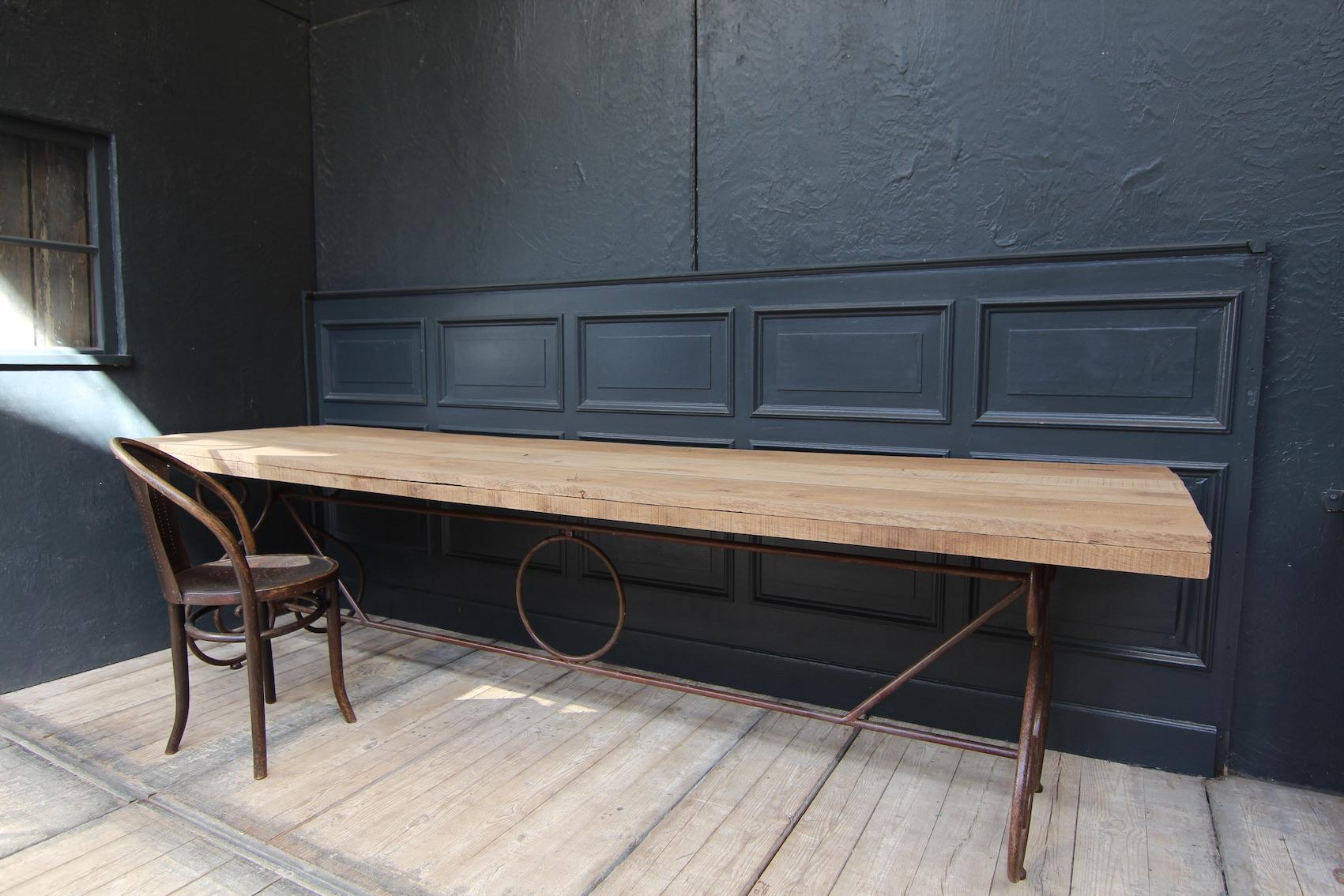 Large French table with metal frame. Originally 1st half 20th century.

Restored ready for everyday use. New top made of natural old oak planks on oak frame.

Dimensions: 
77 cm high / 30.3 inch high,
292 cm wide / 36.2 inch wide, 
81.5 cm