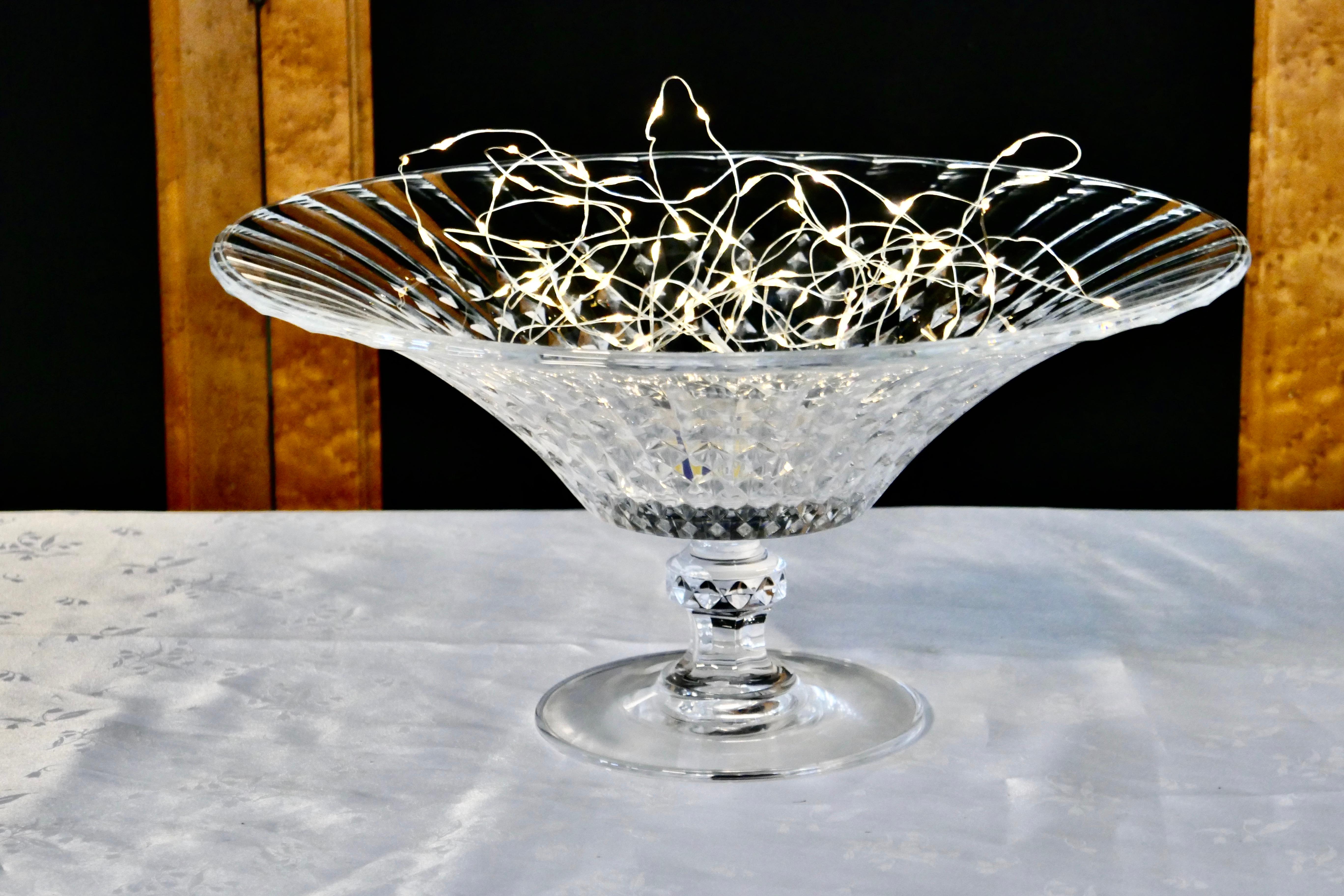 Large French Tazza diamond patterned crystal pedestal fruit dish

A beautiful piece of diamond patterned crystal, the large round dish stands on a heavy multifaceted foot, and is in very good condition no scratches or marks
The dish is 7” tall