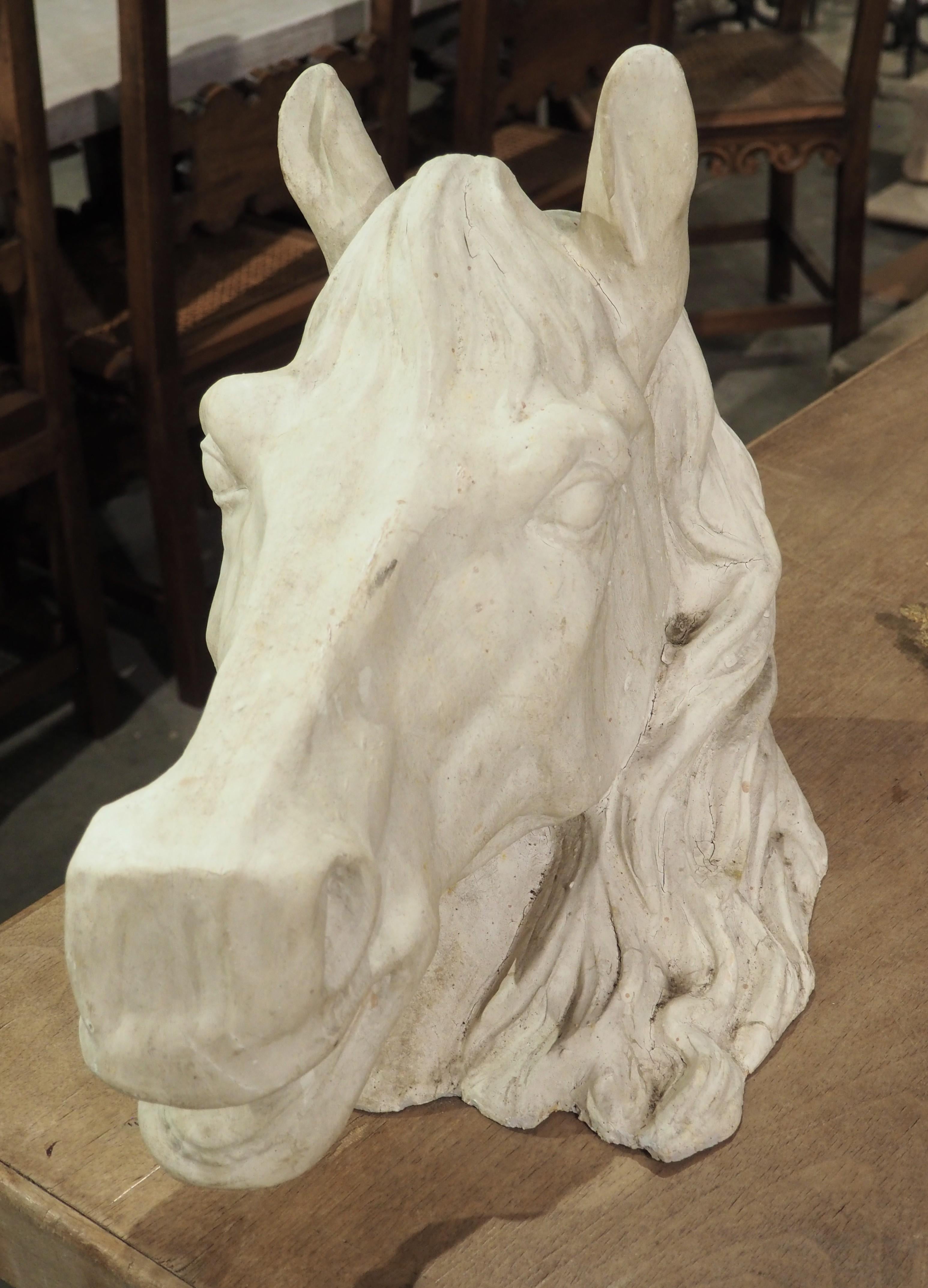 More information coming soon…

The details of this large terracotta horse head sculpture from the 1960s are quite amazing.  The visible musculature of the horse’s jaw, the wavy mane, and the open mouth give the French sculpture a hint of realism.
