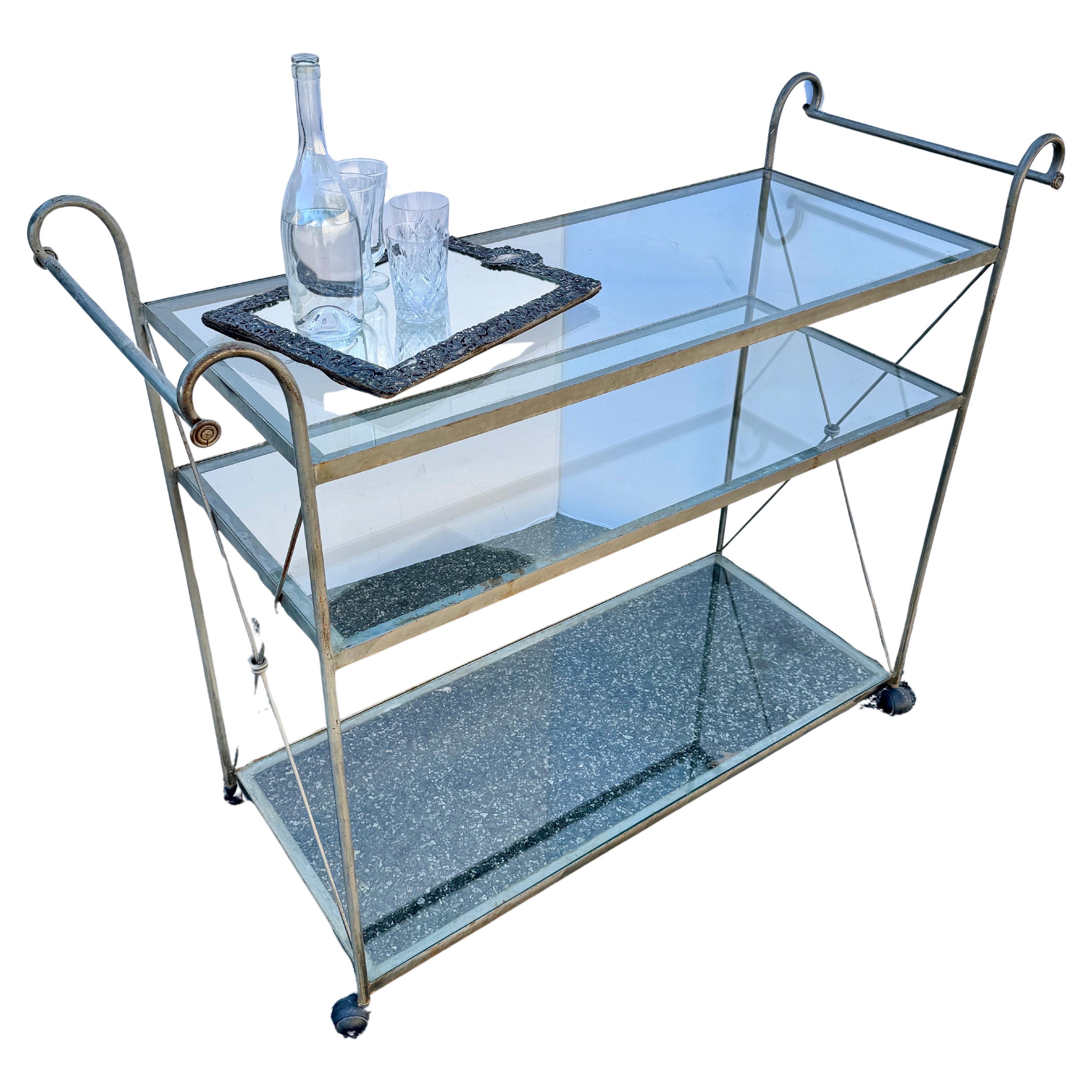 Estate Scale Three Tier Trolley as a Serving Bar Cart Etagere, France circa 1960's

This large vintage double handled cart with three glass shelves set upon casters offer generous space for everything from cocktails or serving dinner to guests.