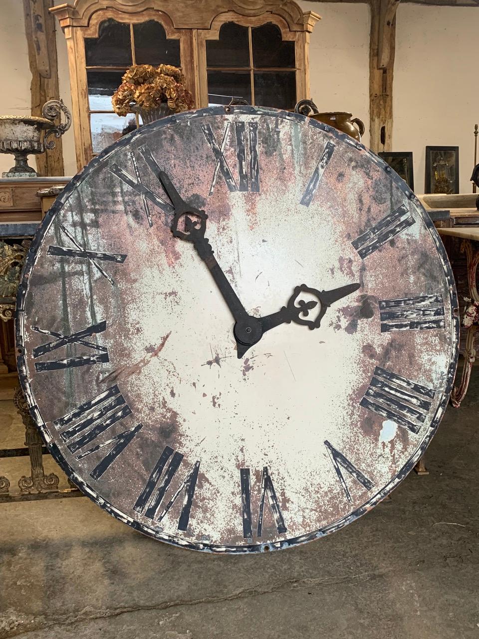 A stunning large French tower clock face made from painted copper. It still has its original metal hands and has been hand painted which has weathered over the years giving it a great look. This clock is not a working clock and is sold as decorative.
