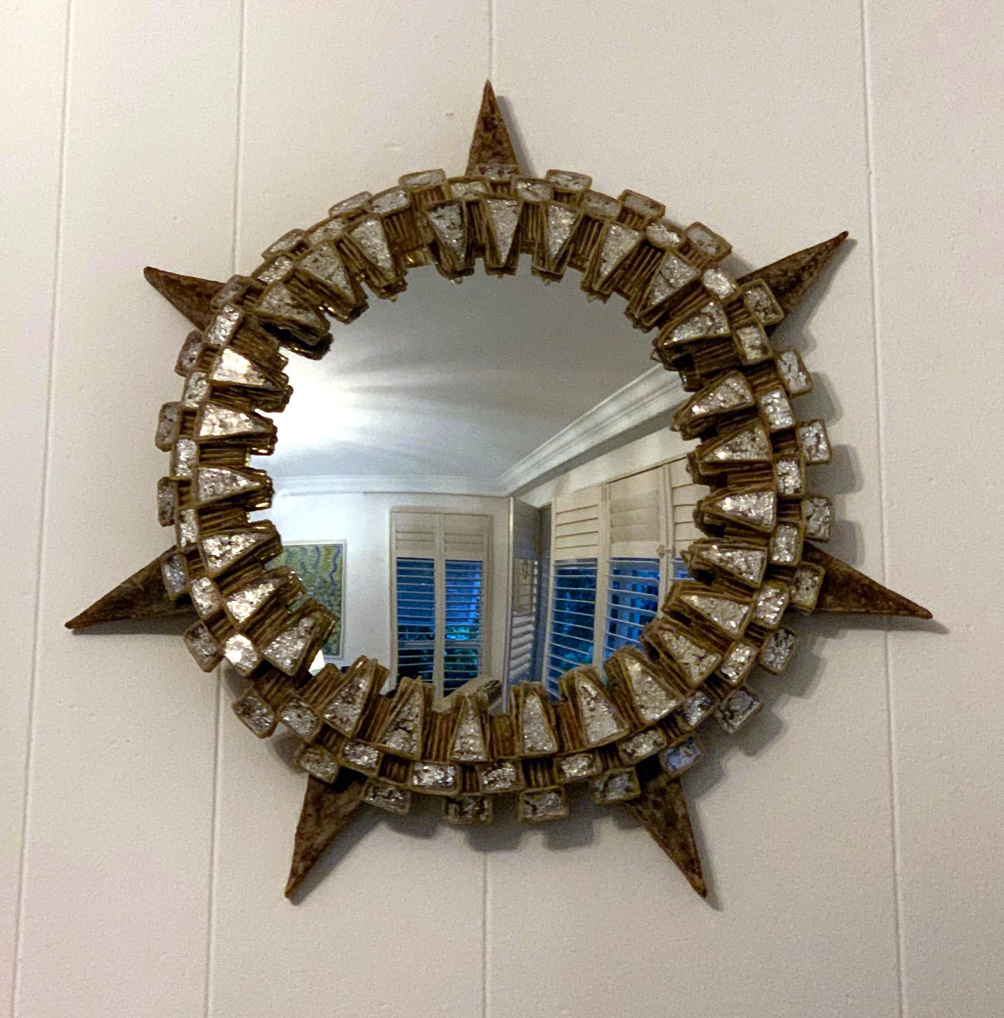 A stunning French convex wall mirror by Parisian art jeweler Line Vautrin (1913-1997) circa 1950s-1960s. A relatively rare model called 