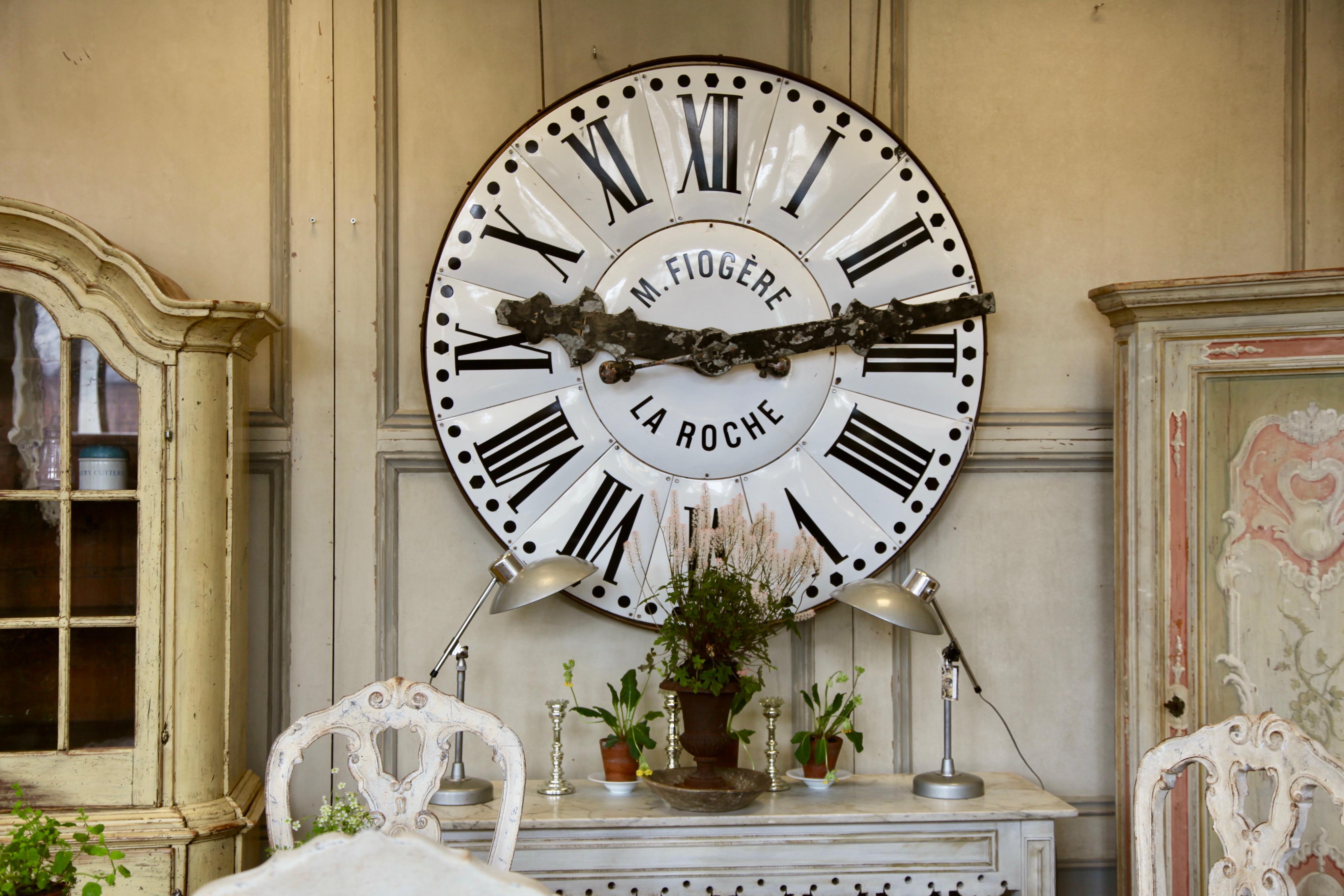 An original town centre clock face from La Roche France, circa 1900. The bombe shaped enamel white face provides a striking contrast to the black Roman numerals. A classic and grand timeless piece.
10 cm depth