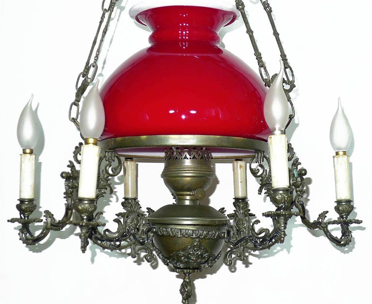 Beautiful antique 1950s large French Victorian seven-light hanging oil lamp chandelier with ruby red Opaline glass shade/chiselled bronze 

Materials: Opaline glass/chiselled bronze/ brass
Measures:
Diameter 24 inches / 60 cm
Height 40 inches / 100