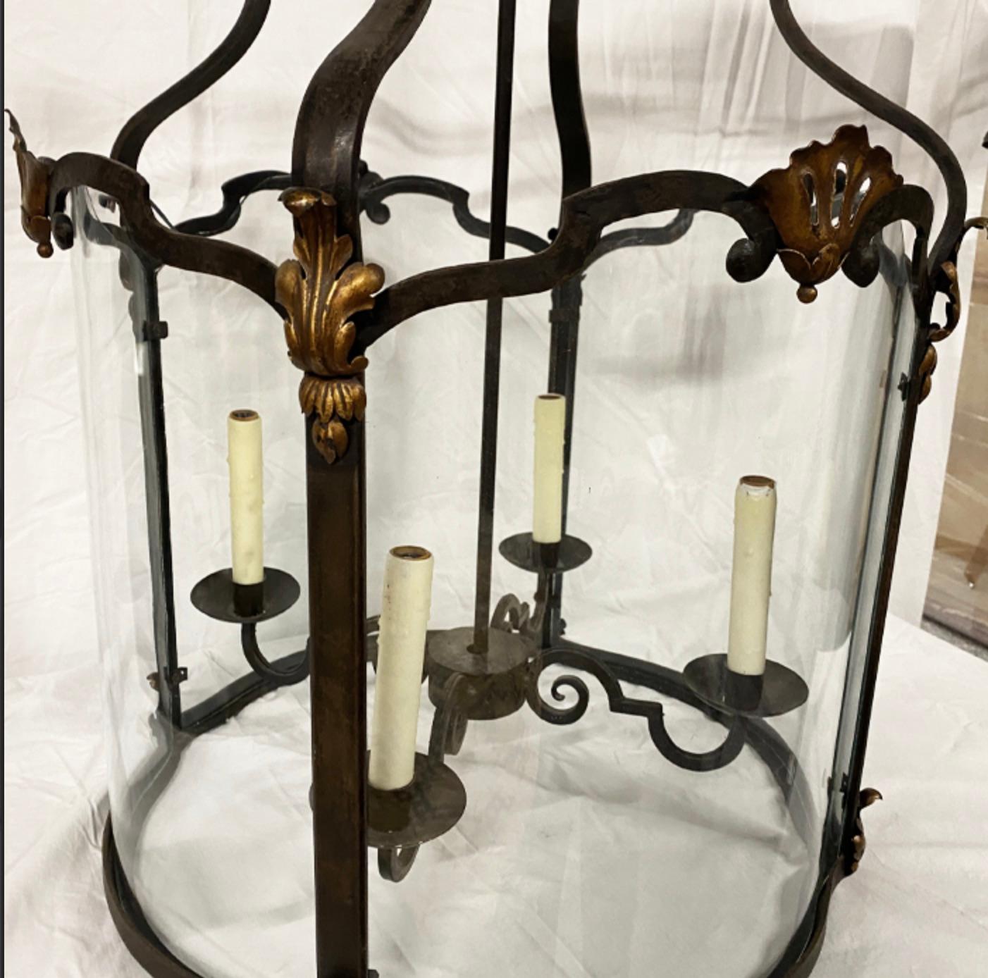 Large French Vintage Wrought Iron Lantern with Gilt detail 

Interior Glass Panels Provided

