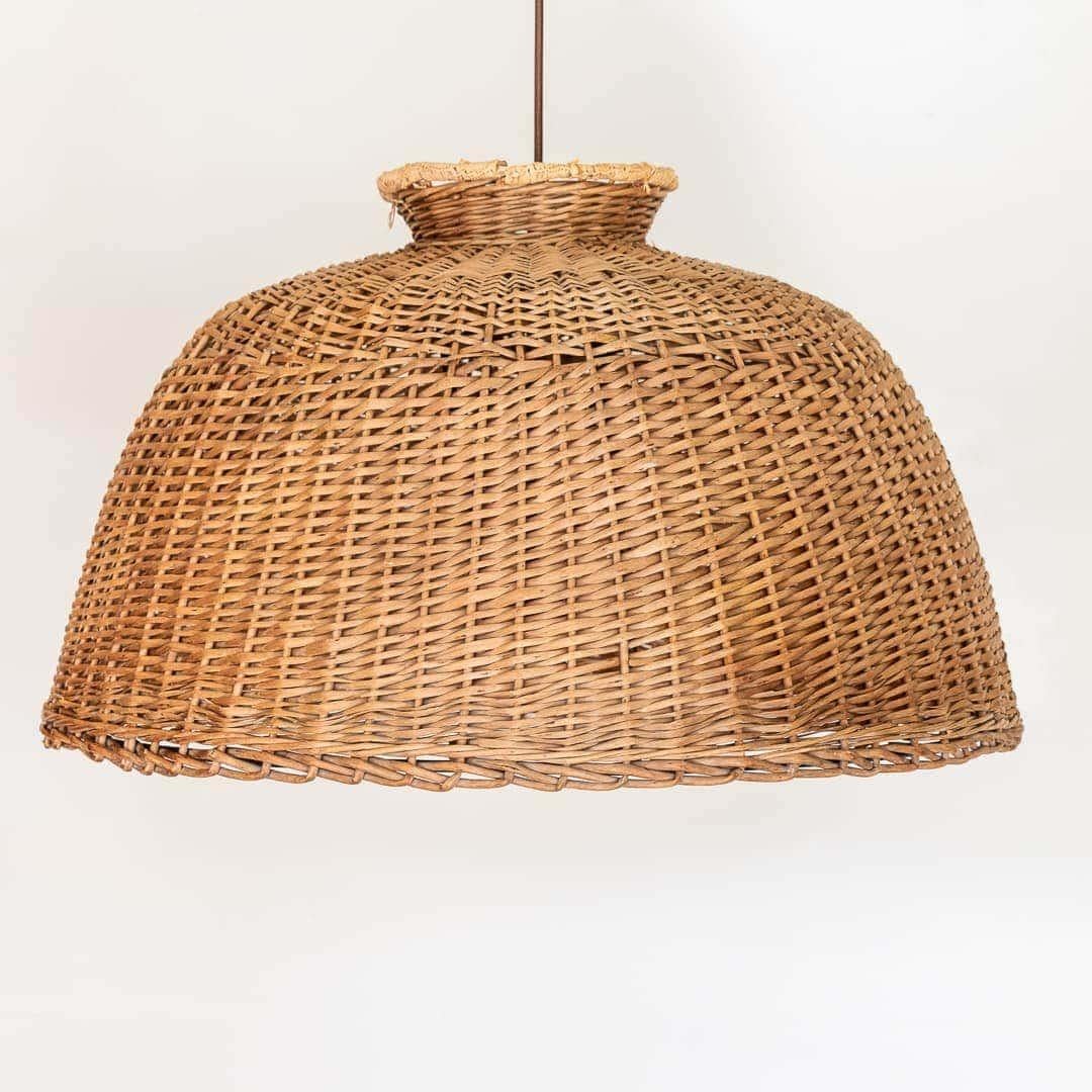 Great large-scale vintage wicker dome light from France, 1950s. Original tight woven wicker with wrapped raffia detail on top showing some nice age and wear. Interior has black iron frame. Newly re-wired with a single medium base socket and a new