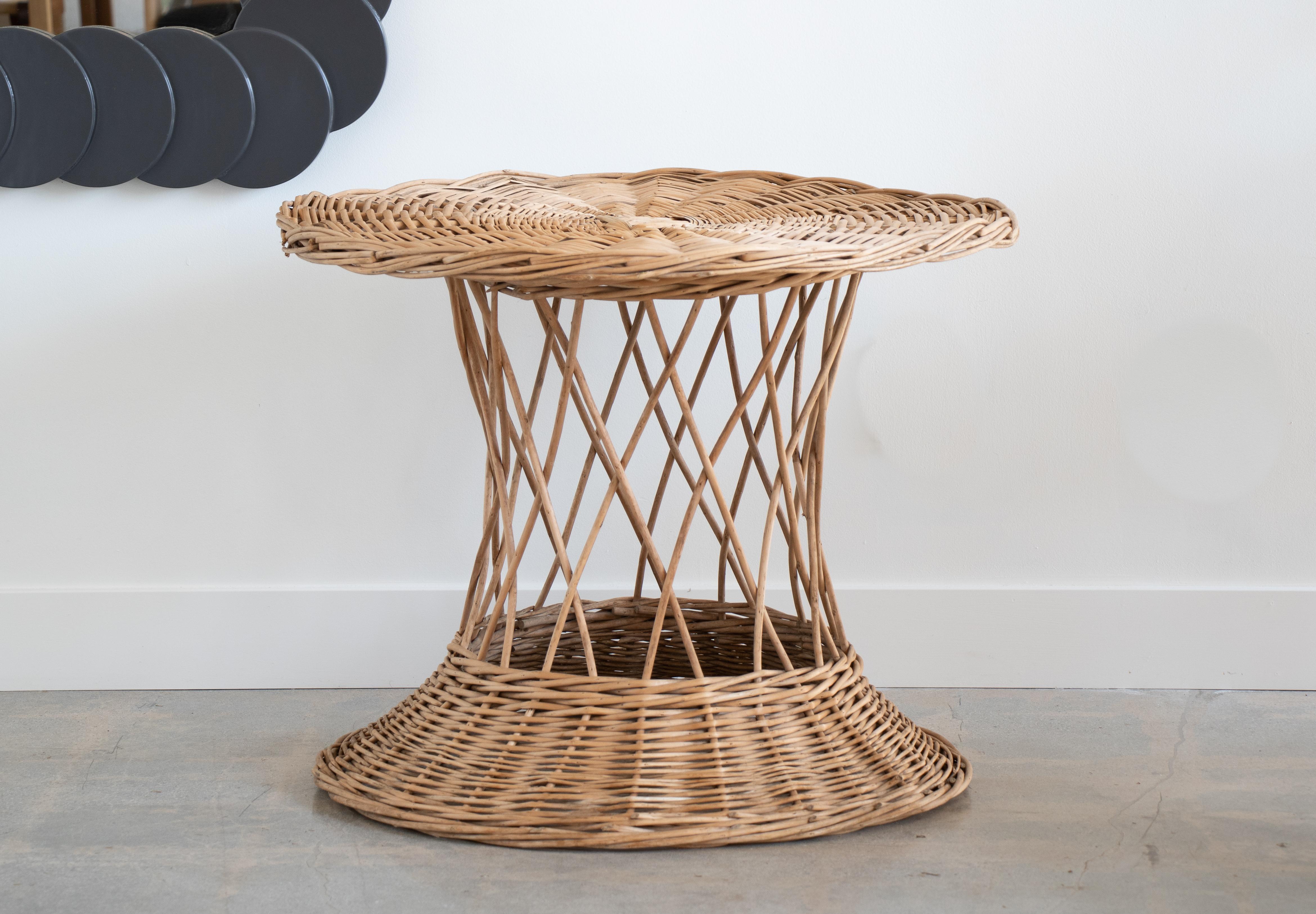 Vintage large wicker diabolo shaped table from France. Nice original condition with beautiful braided wicker detail. Signs of patina and age.