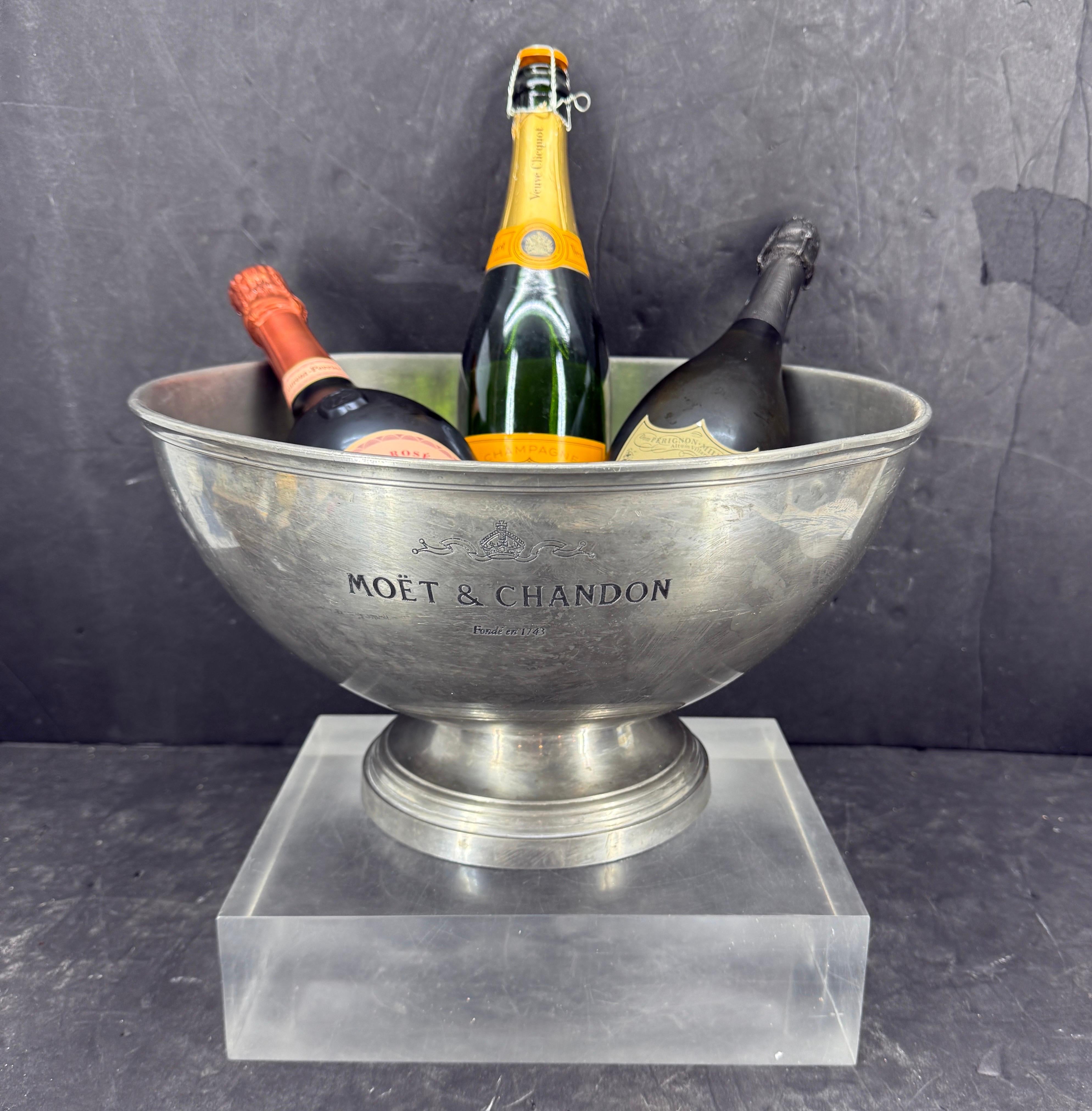 This vintage champagne and wine cooler bucket, from the 1950’s, features a charming pewter finish. It is branded MOET & CHANDON fondé en 1743. As seen throughout Europe this hand-cast bucket will elevate any occasion. The natural patina of a piece