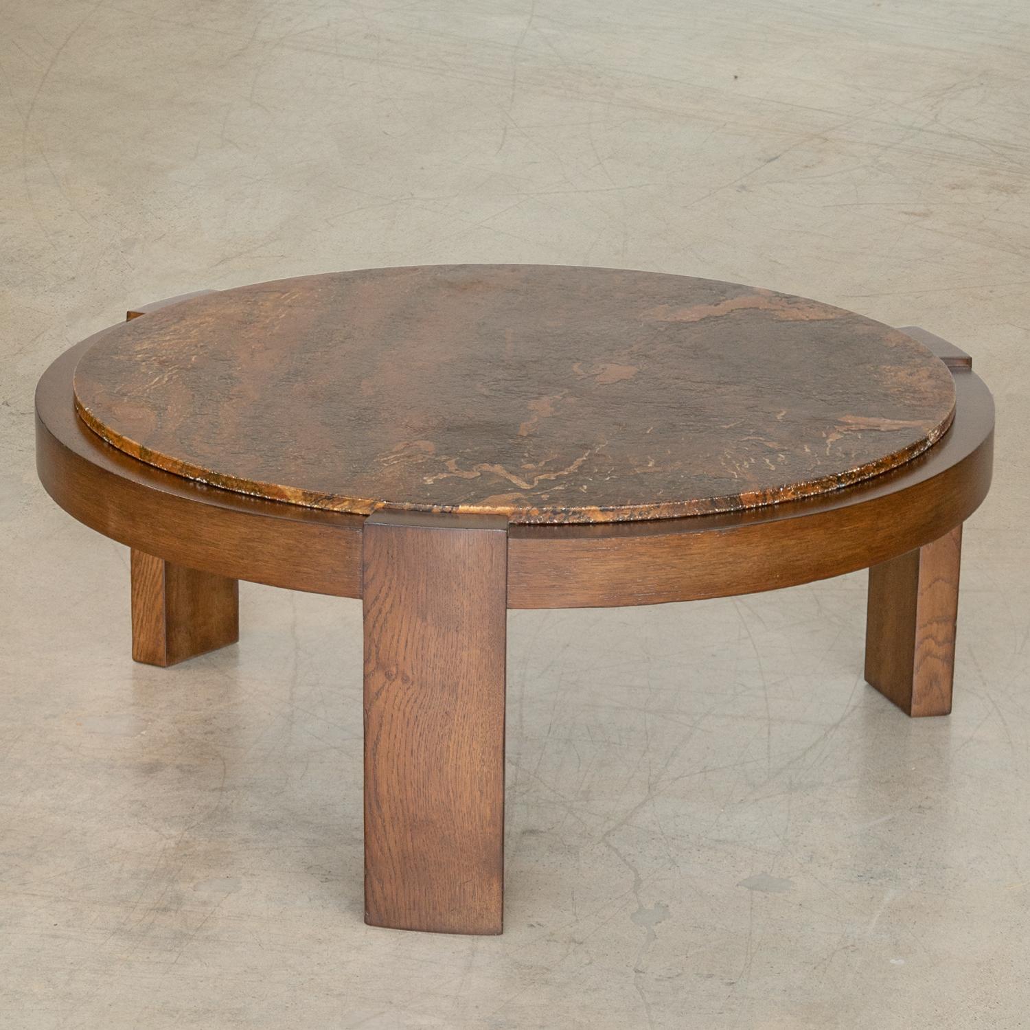 Unique large vintage wood and stone coffee table from France, 1960s. Beautiful textured brown marbled stone top rests on large circular wood frame with three wide legs. Original stone top and newly refinished wood base.
