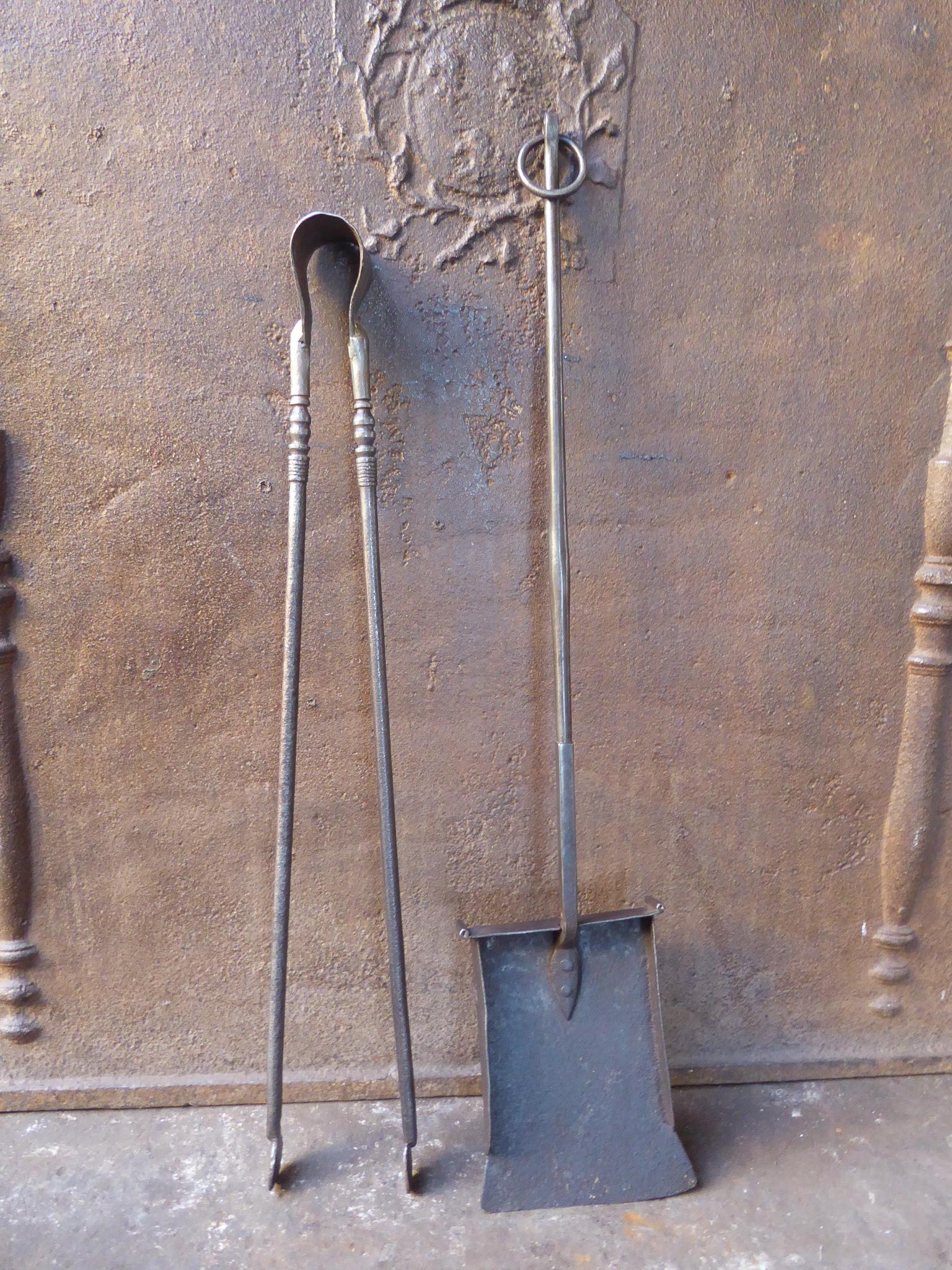 17th-18th century French Louis XIV fireplace tool set. The fire irons are made of wrought iron. They are in a good condition and fully functional.