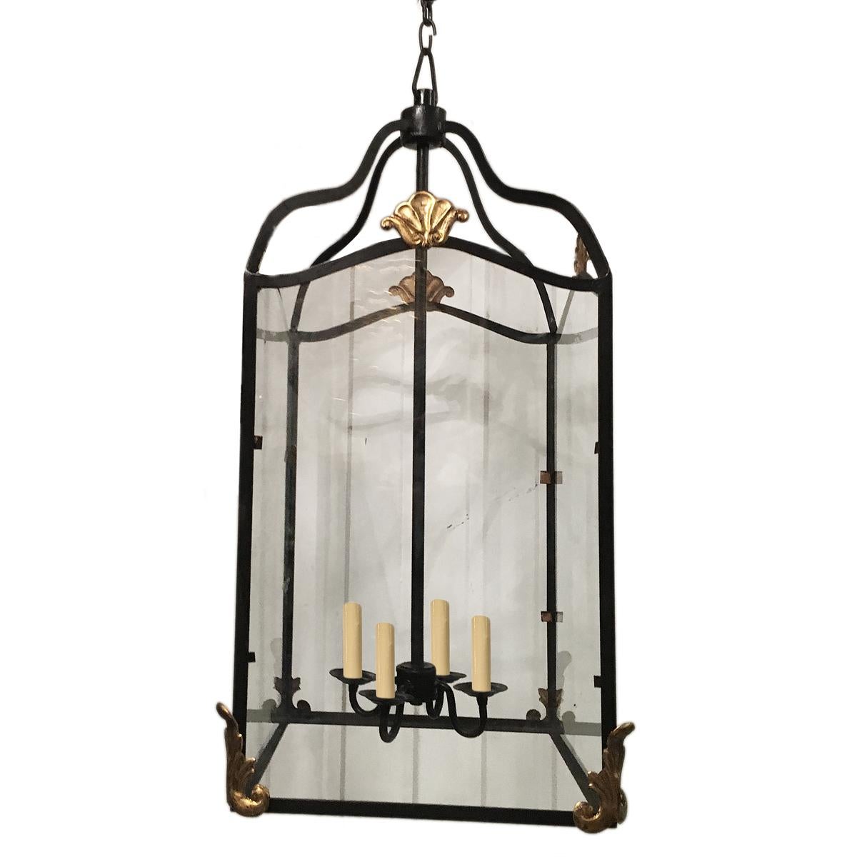 A circa 1950s French wrought iron lantern with gilt details. 5 interior lights.

Measurements:
Height 36