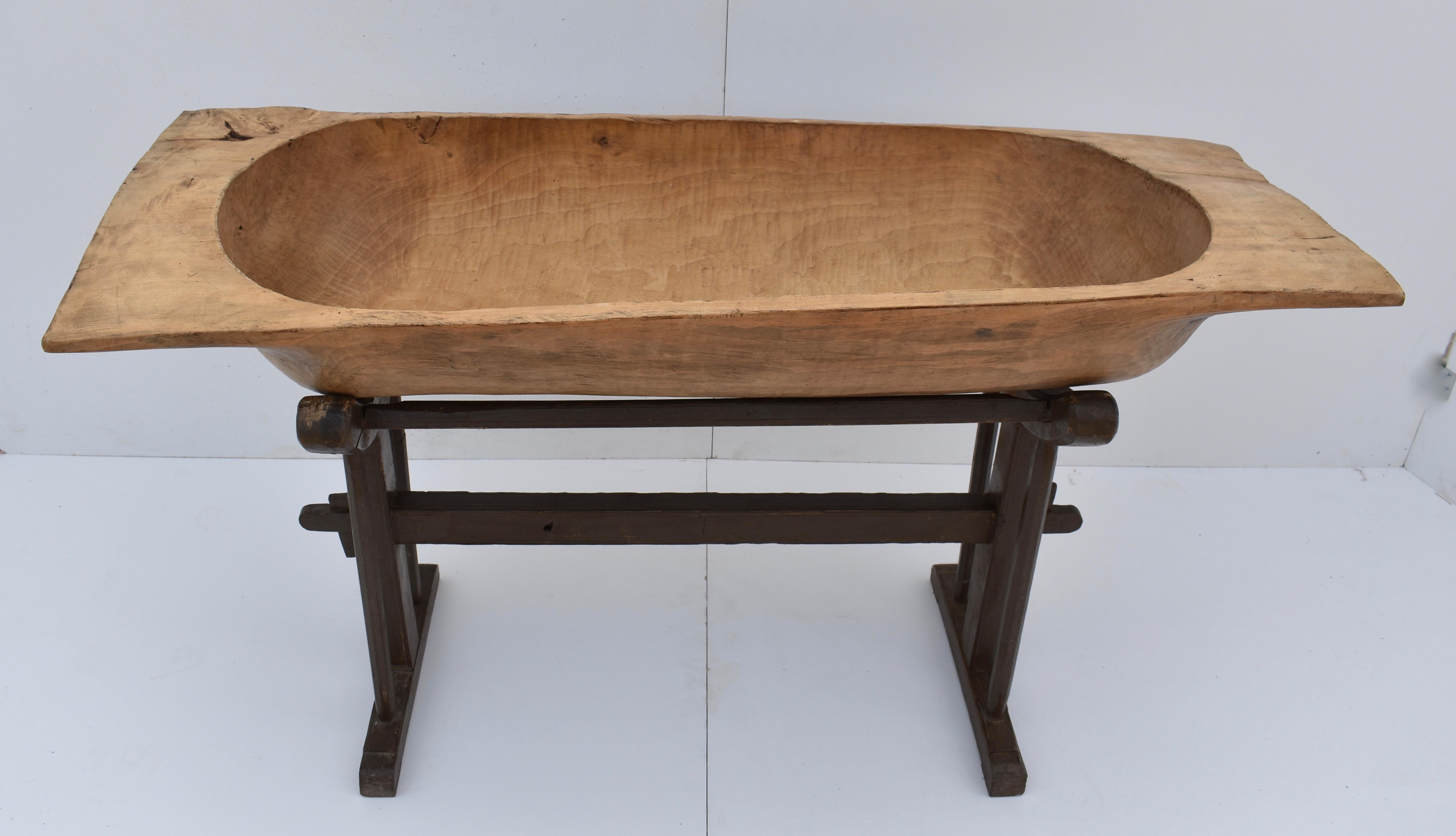 Used for kneading dough for multi-family baking or perhaps for washing the baby, this huge fruitwood trog was hand-hewn from a single split log. It has developed something of a twist over the years but its rounded bottom sits nicely in the curved