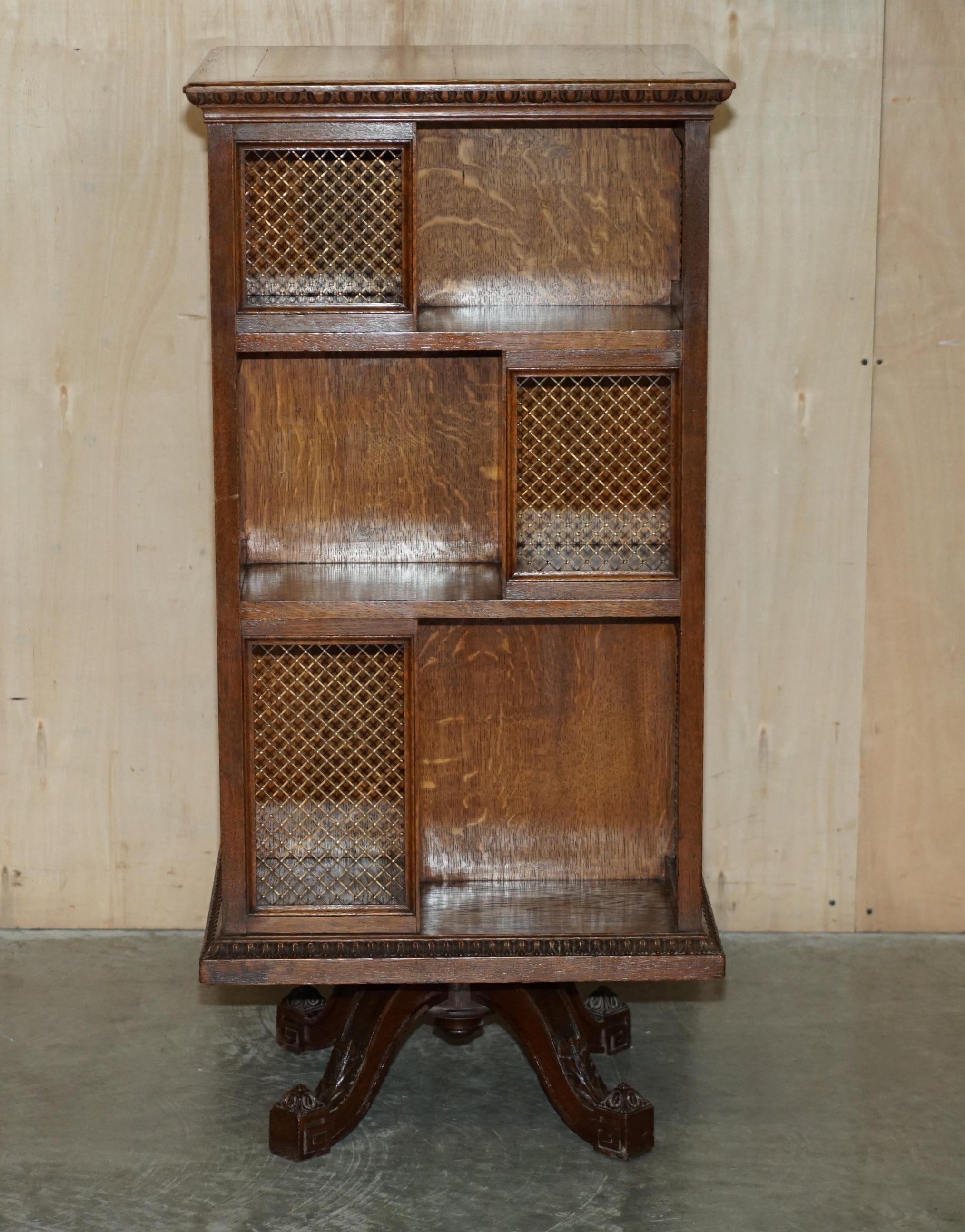 We are delighted to offer for sale this very well made English oak circa 1880-1900 fully restored revolving bookcase table with brass fret work panels and ornately carved legs 

A good looking and well made piece, you can fit an entire at home