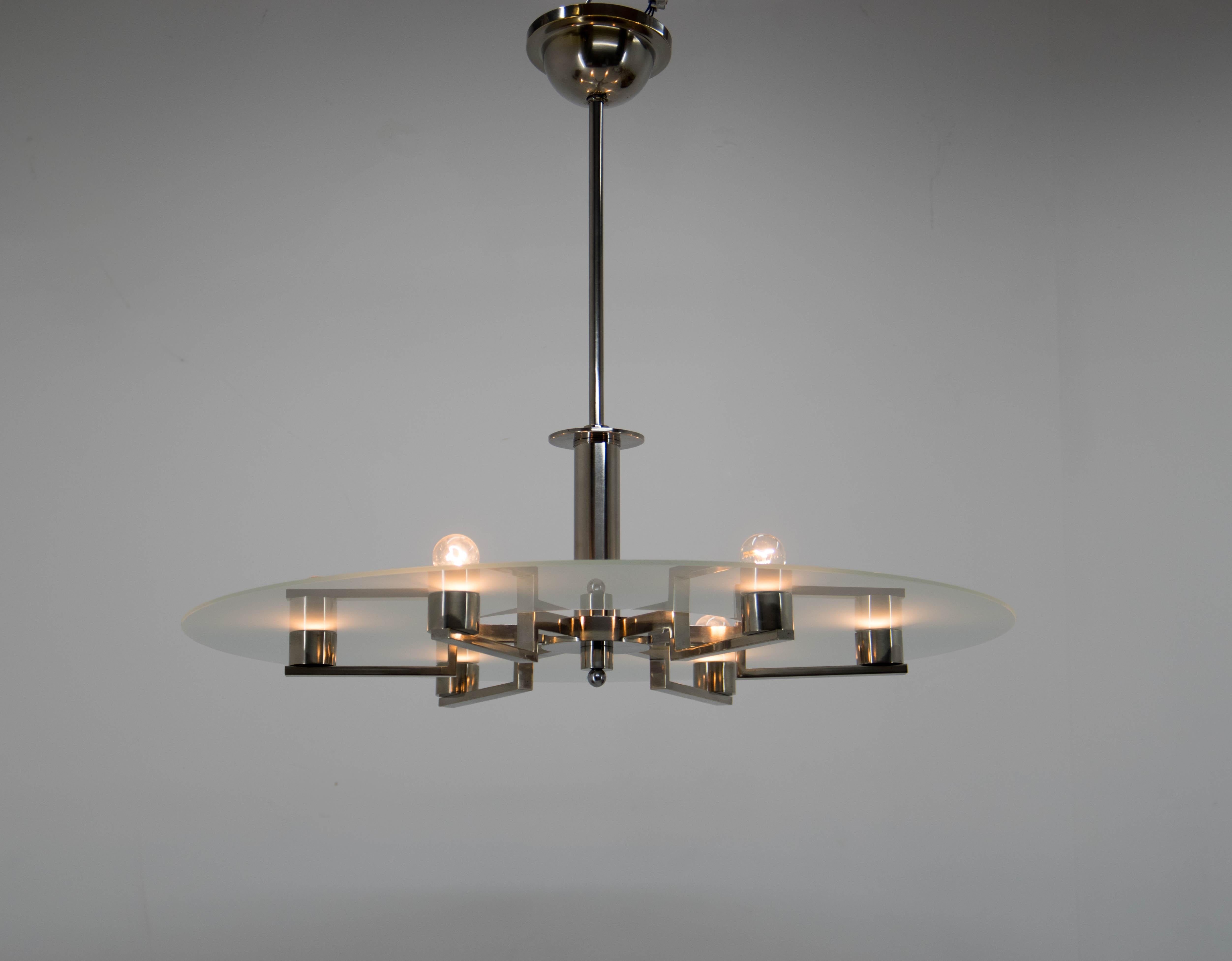 Magnificent Bauhaus or Functionalist chandelier.
Timeless design with simple and clean lines.
Original nickel polished.
New sandblasted glass
Rewired - two separate circuits: 3+3x40W, E25-E27 bulbs
US wiring compatible.
Shipping quote on request.