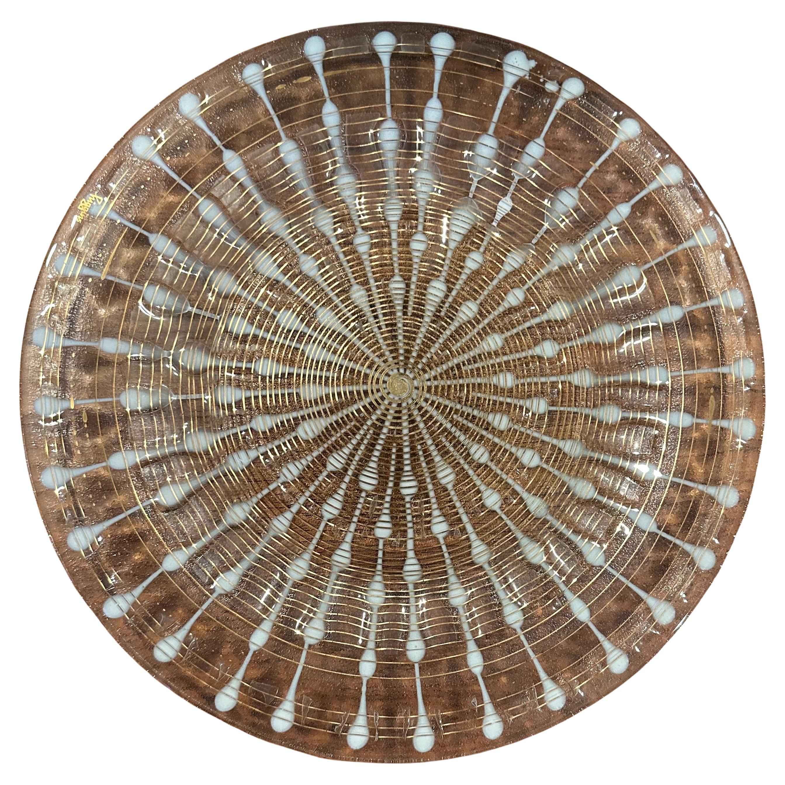 Large fused art glass atomic age round tray by Michael & Frances Higgins, circa 1950s. The piece is executed in the fused glass technique by the Higgins Studio and has a great atomic design.  The tray is in very good vintage condition with no chips