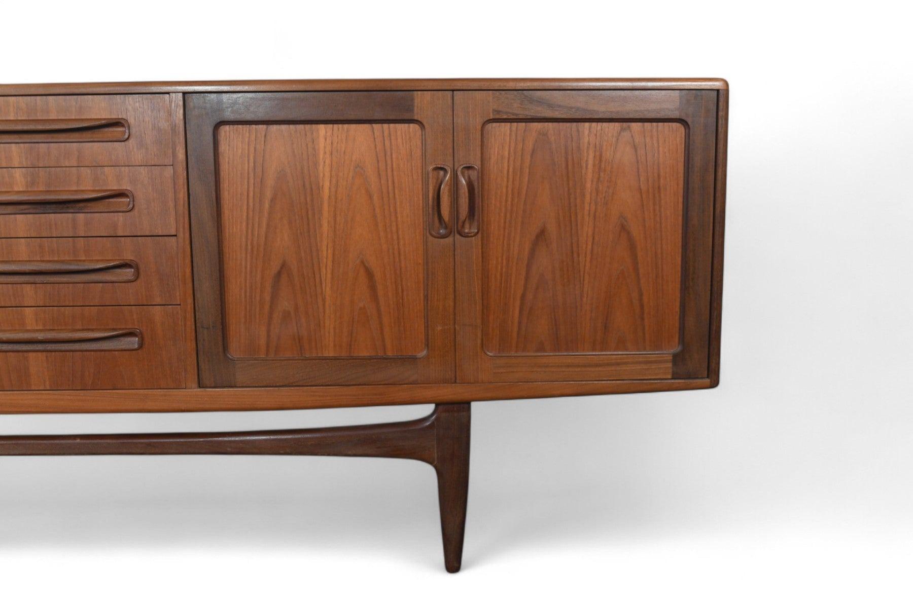Origin: England
Designer: Victor B. Wilkins
Manufacturer: G Plan
Era: 1960s
Materials: Teak, Afromosia
Measurements: 84″ wide x 18″ deep x 31.5″ tall