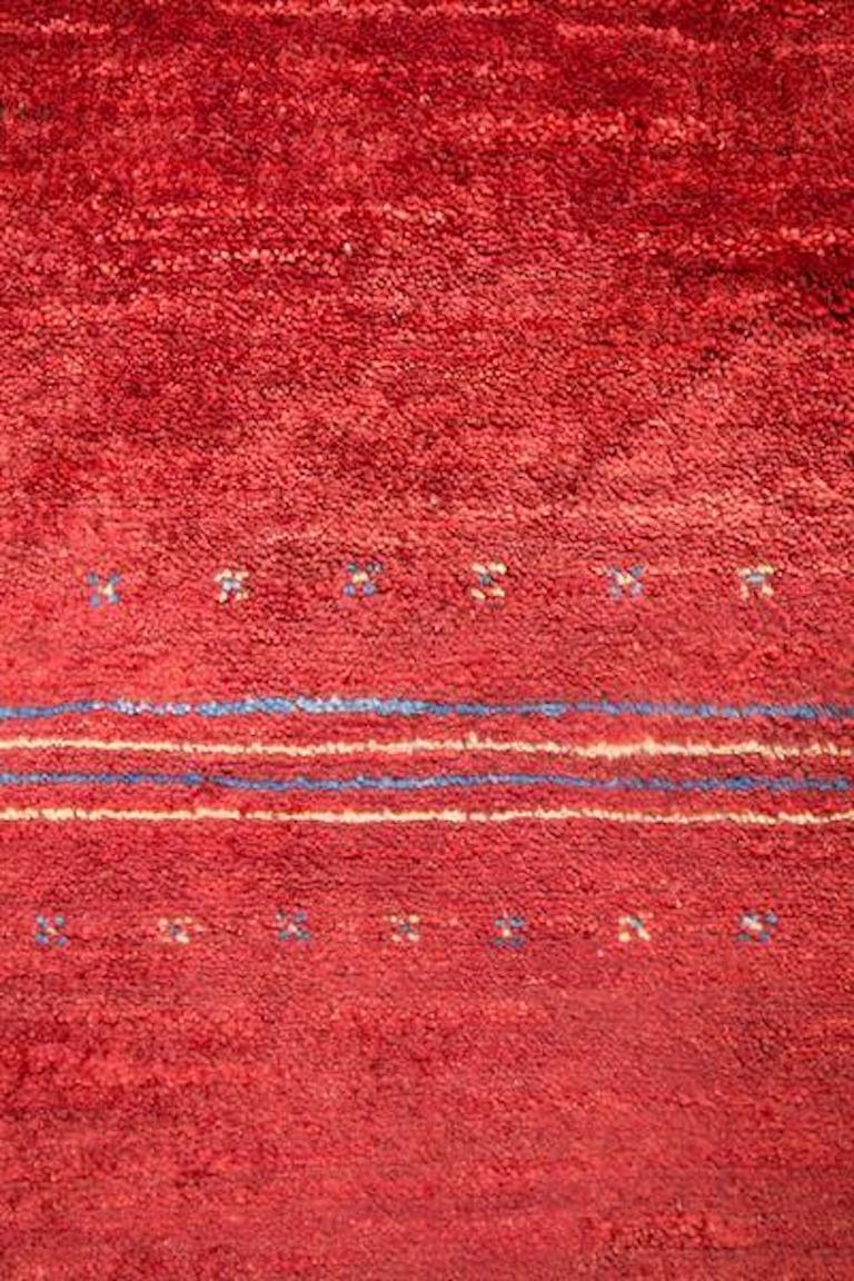 Large Red Striped Contemporary Gabbeh Persian Wool Rug. Moody, dramatic strips of saturated red form this Gabbeh in one of the most Classic styles. In Gabbeh fashion, there's the perfect balance of organic and structured design, with no matching or