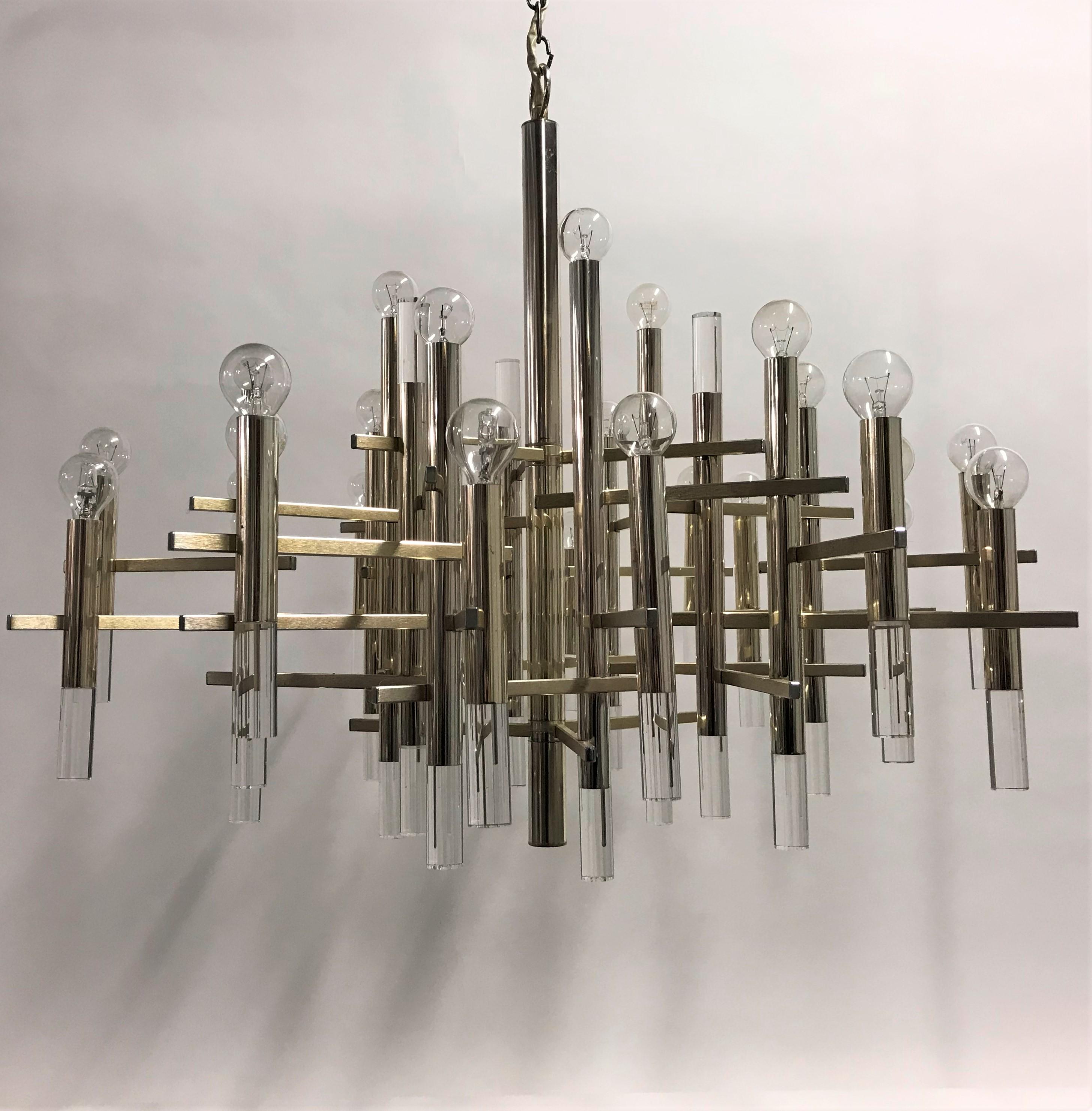 Huge Mid-Century Modern chrome and Lucite chandelier by Gaetano Sciolari.

The chandelier has 26 E14 light points, all tested and ready for use.

The chandelier really has a 'wow' effect due to it's size and beautiful architectural