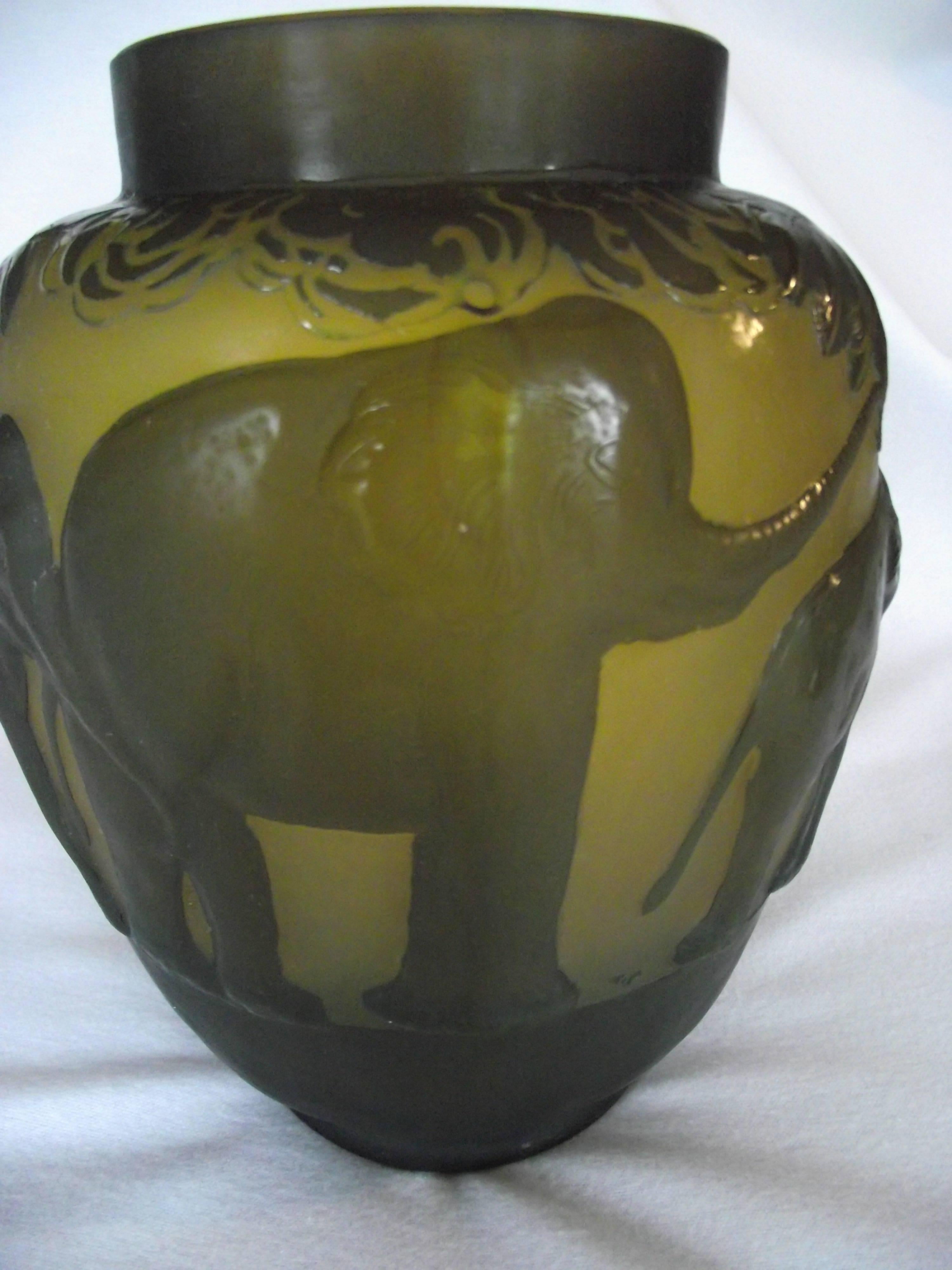 This beautiful signed Galle elephant vase is very impressive. In extremely good condition no chips or scratches. I have also included pictures looking to the inside of the vase. As you can see the images have not been ground out on the inside.