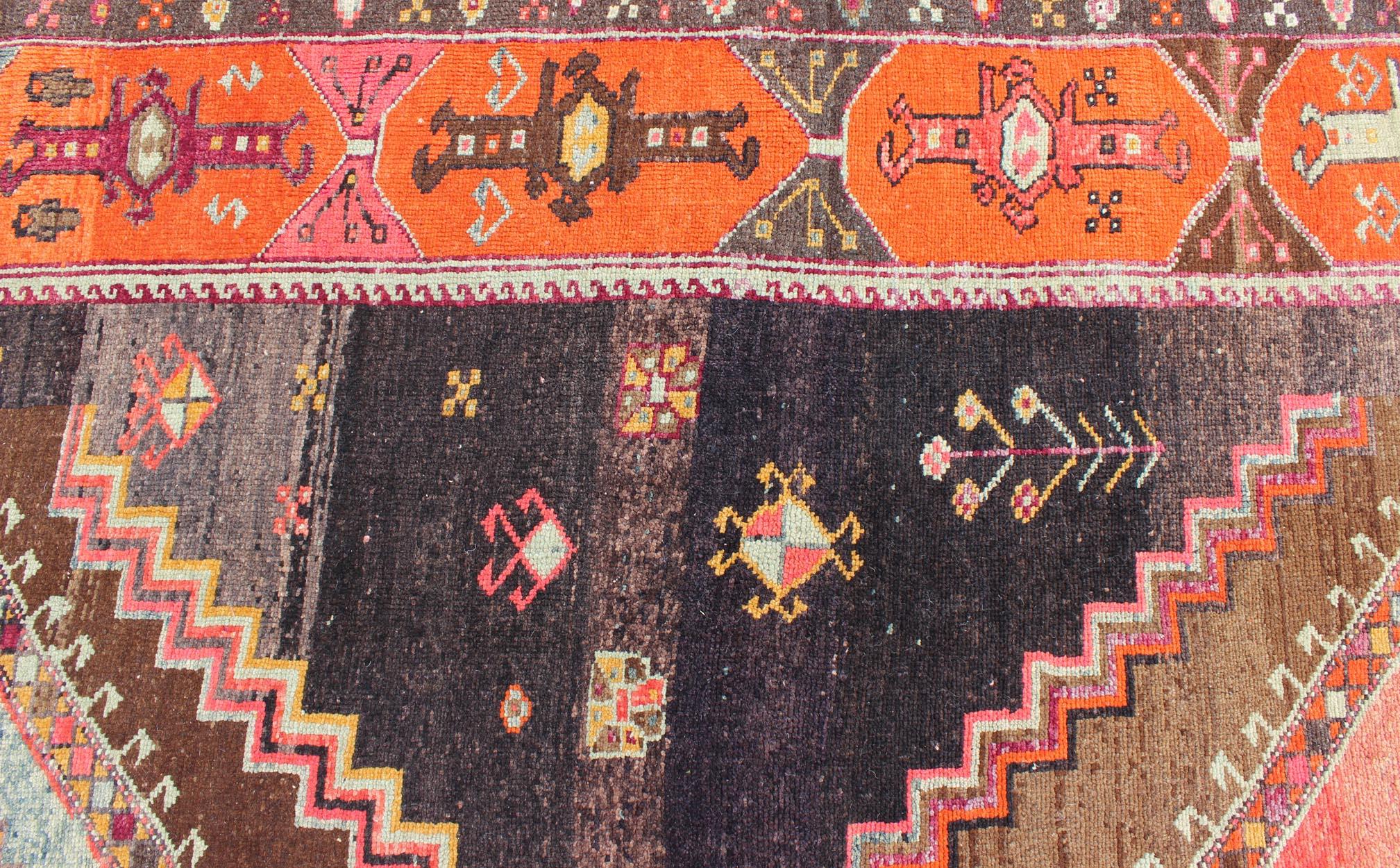 Vintage wide and long gallery runner from Turkey with geometric layered Medallion design in Brown background and various tones of orange, coral, salmon, pink, light blue, and light green color, rug TU-TRS-3260, country of origin / type: Turkey /