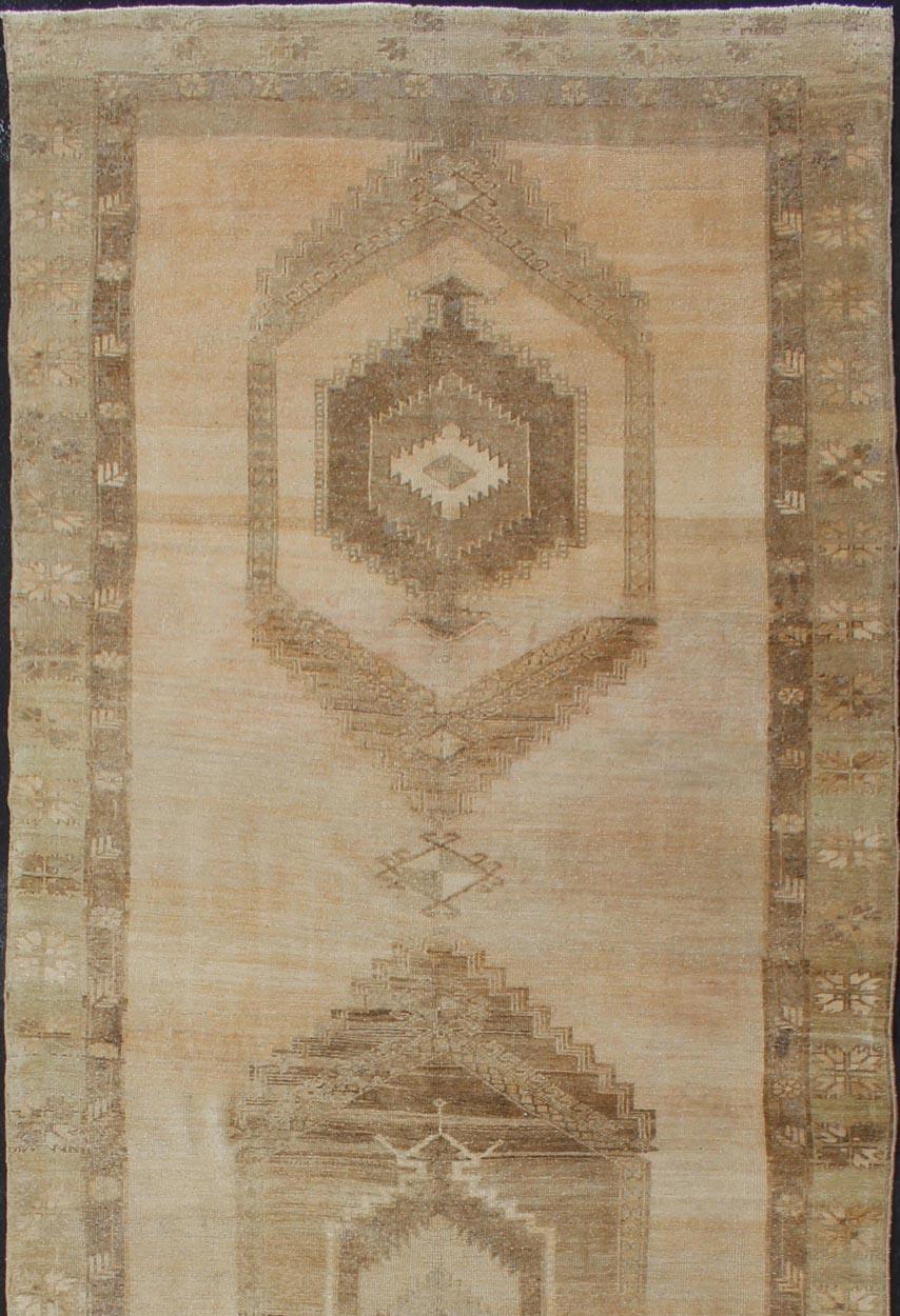 Vintage wide Gallery runner from Turkey with Geometric Medallion design in various tones earth colors such as of tan, sand, taupe and light brown rug TU-ALK-3587, country of origin / type: Turkey / Kars, circa 1940. Large Gallery Turkish rug in