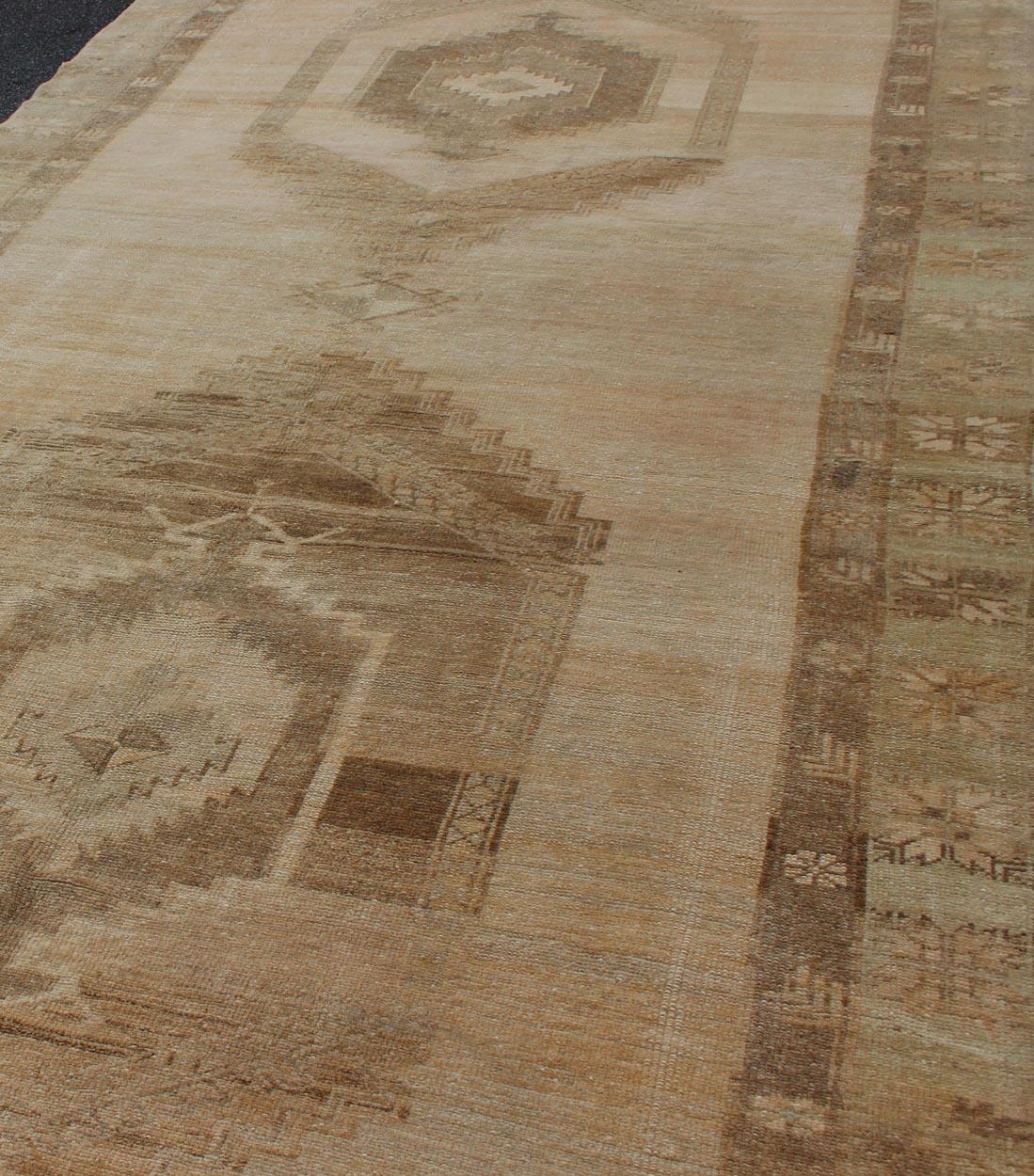 Large Gallery Runner Turkish Rug in Earth Tones & Light Brown in Medallions In Good Condition For Sale In Atlanta, GA